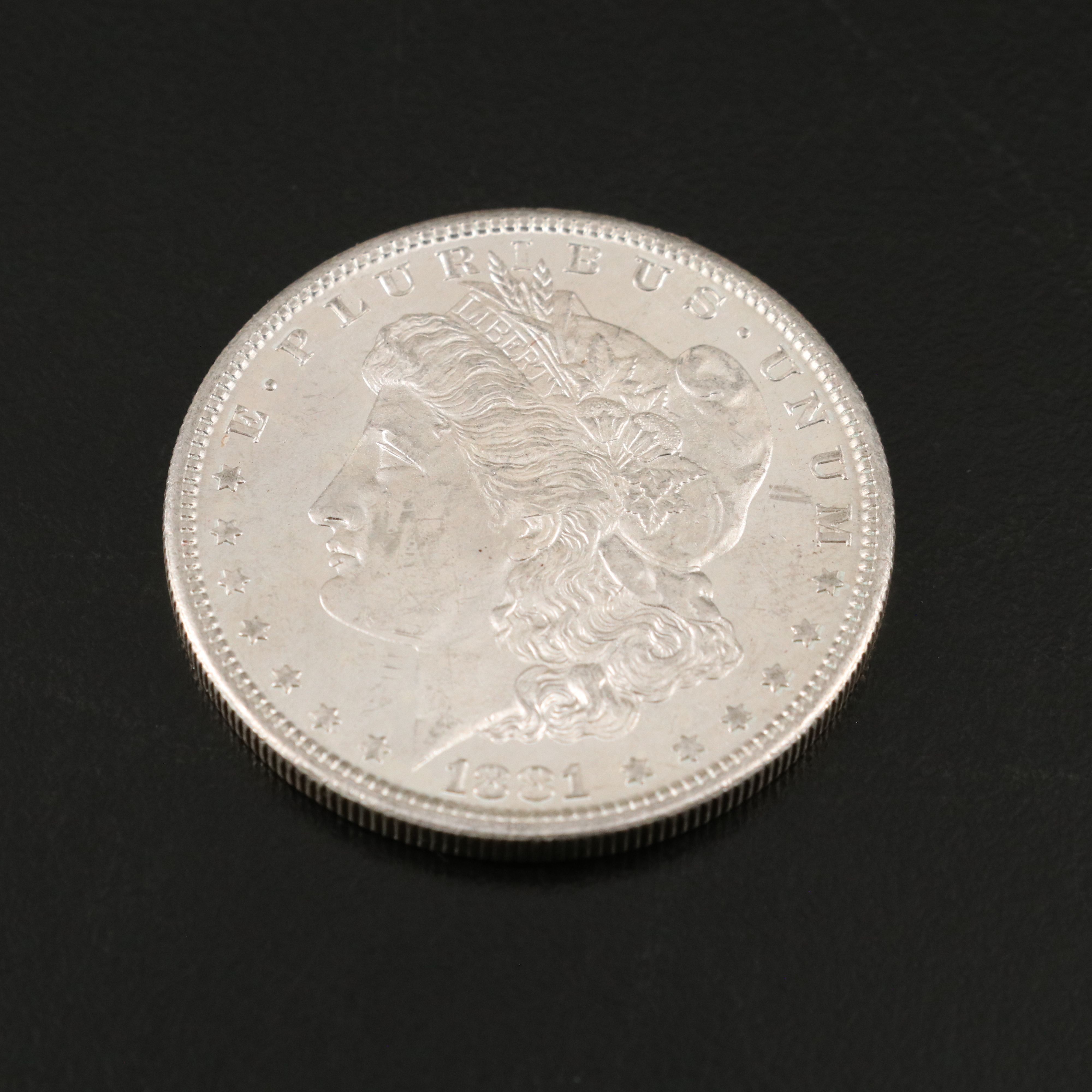 Two U.S. Morgan and Peace Silver Dollars
