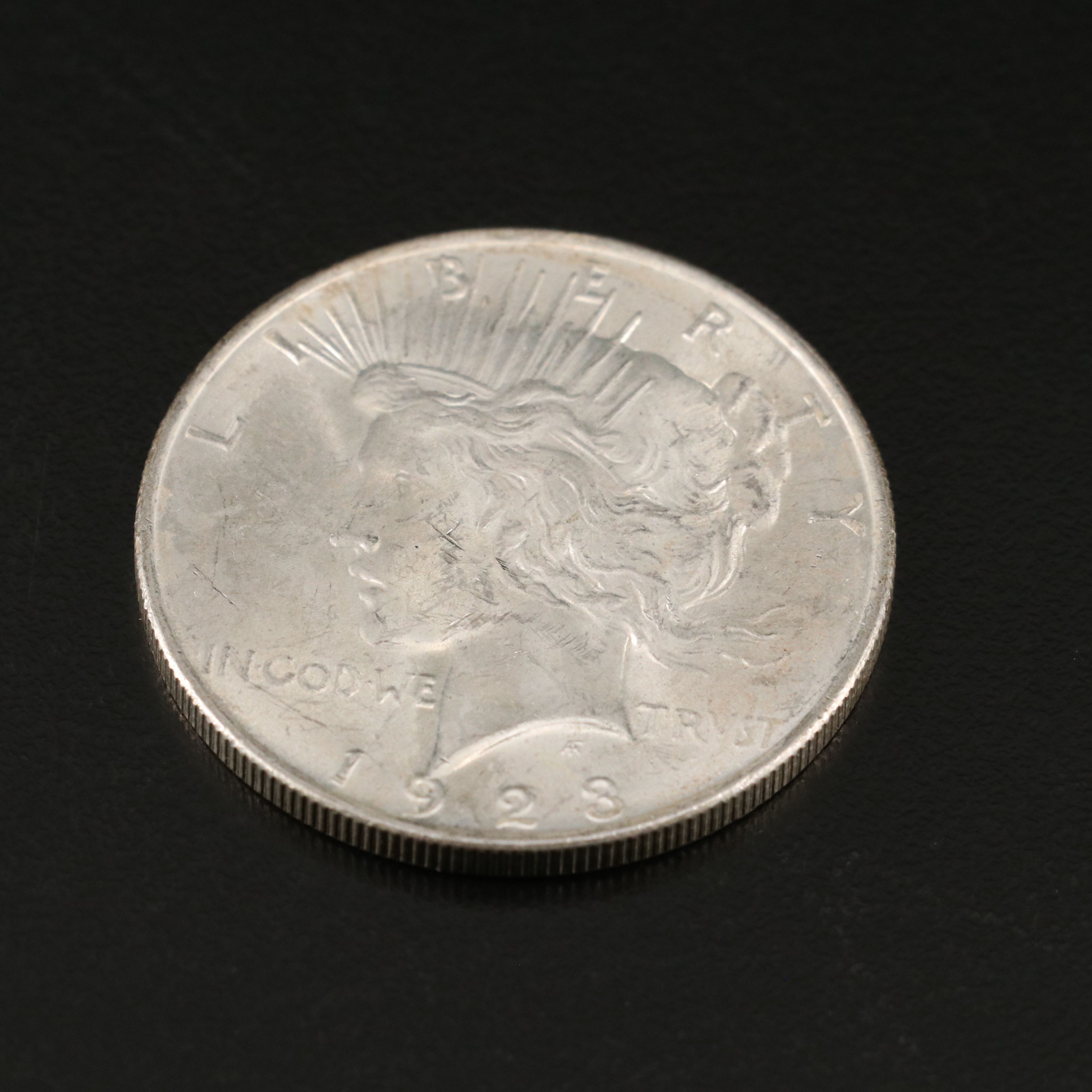 Two U.S. Morgan and Peace Silver Dollars