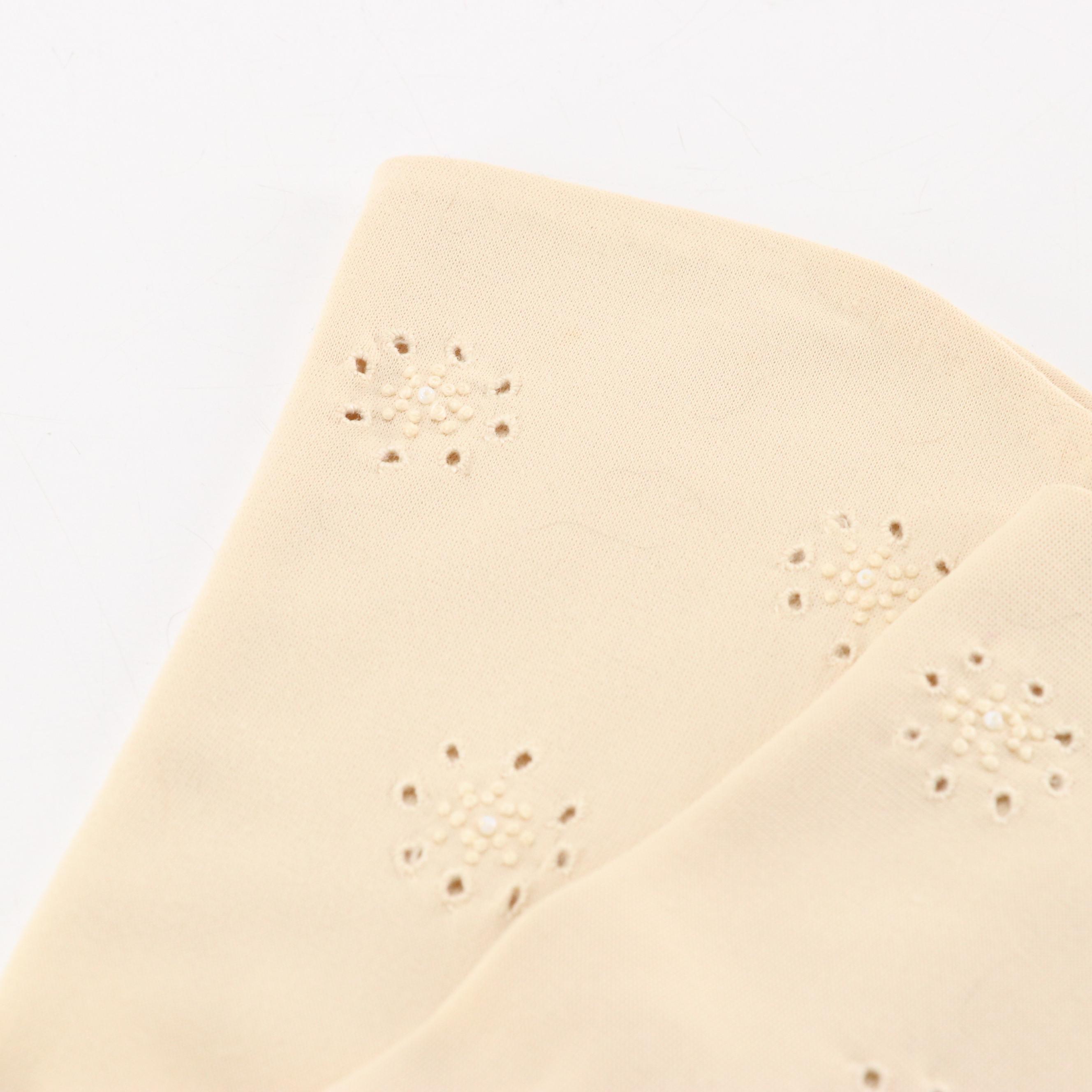 Black Shortie and Off-White Bracelet Length Fashion Gloves, circa 1960