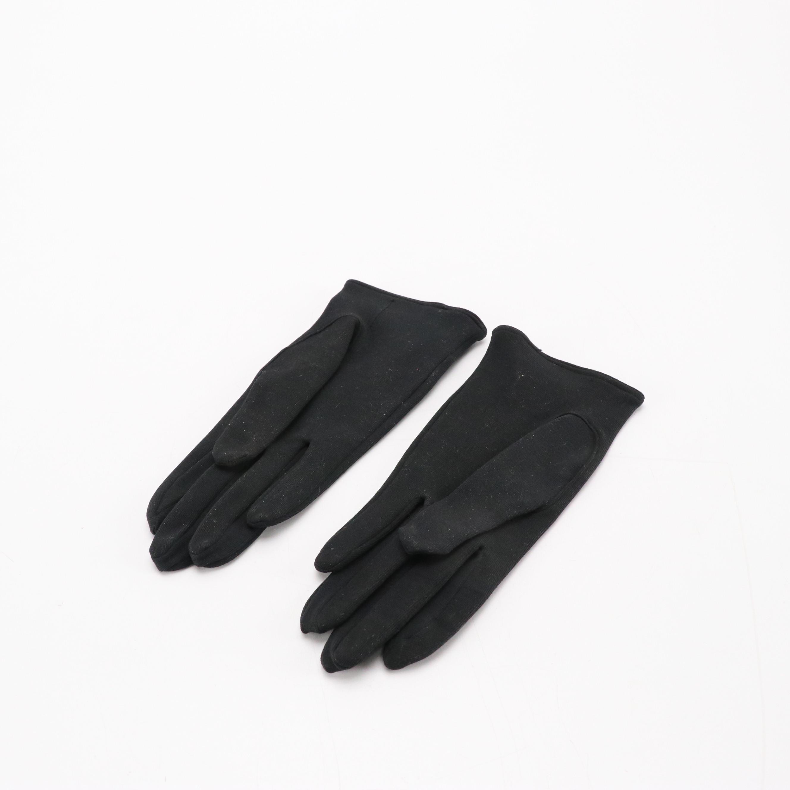 Black Shortie and Off-White Bracelet Length Fashion Gloves, circa 1960