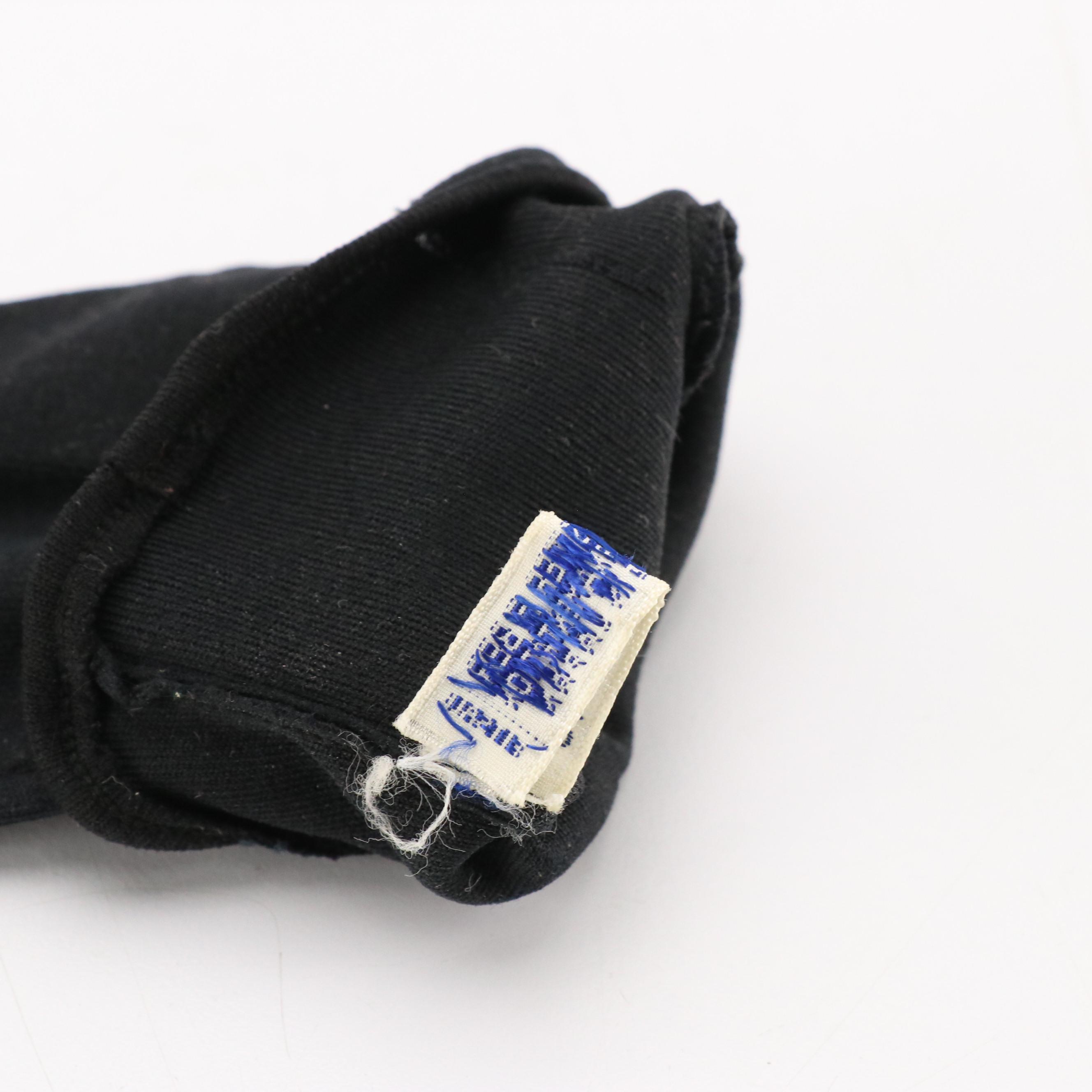 Black Shortie and Off-White Bracelet Length Fashion Gloves, circa 1960