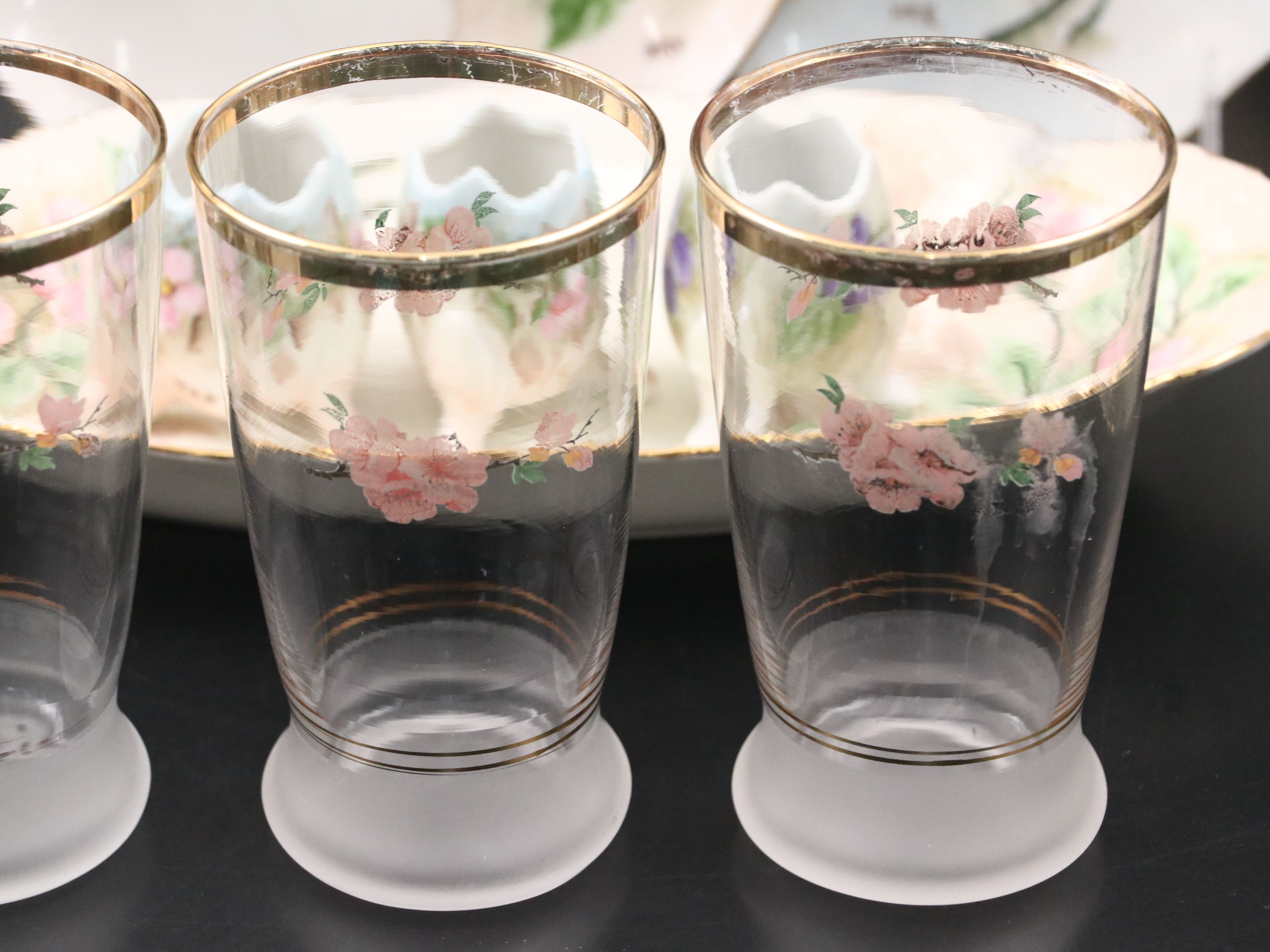 Hand-Painted Porcelain Serveware and Gilt Tumblers