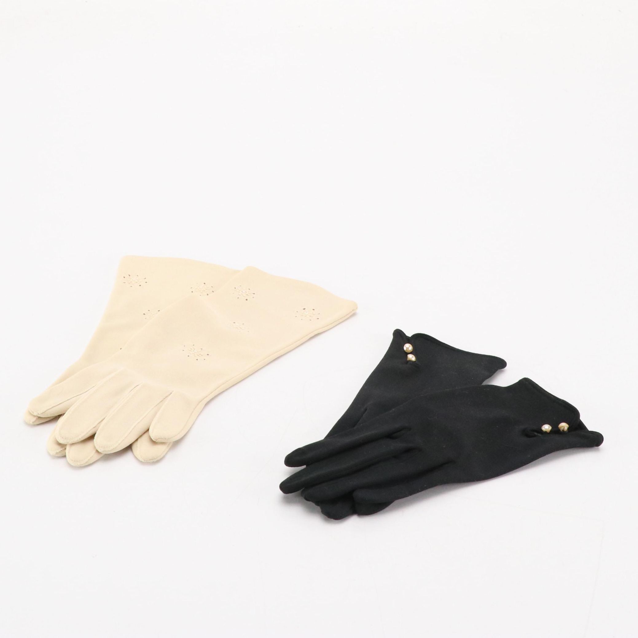 Black Shortie and Off-White Bracelet Length Fashion Gloves, circa 1960