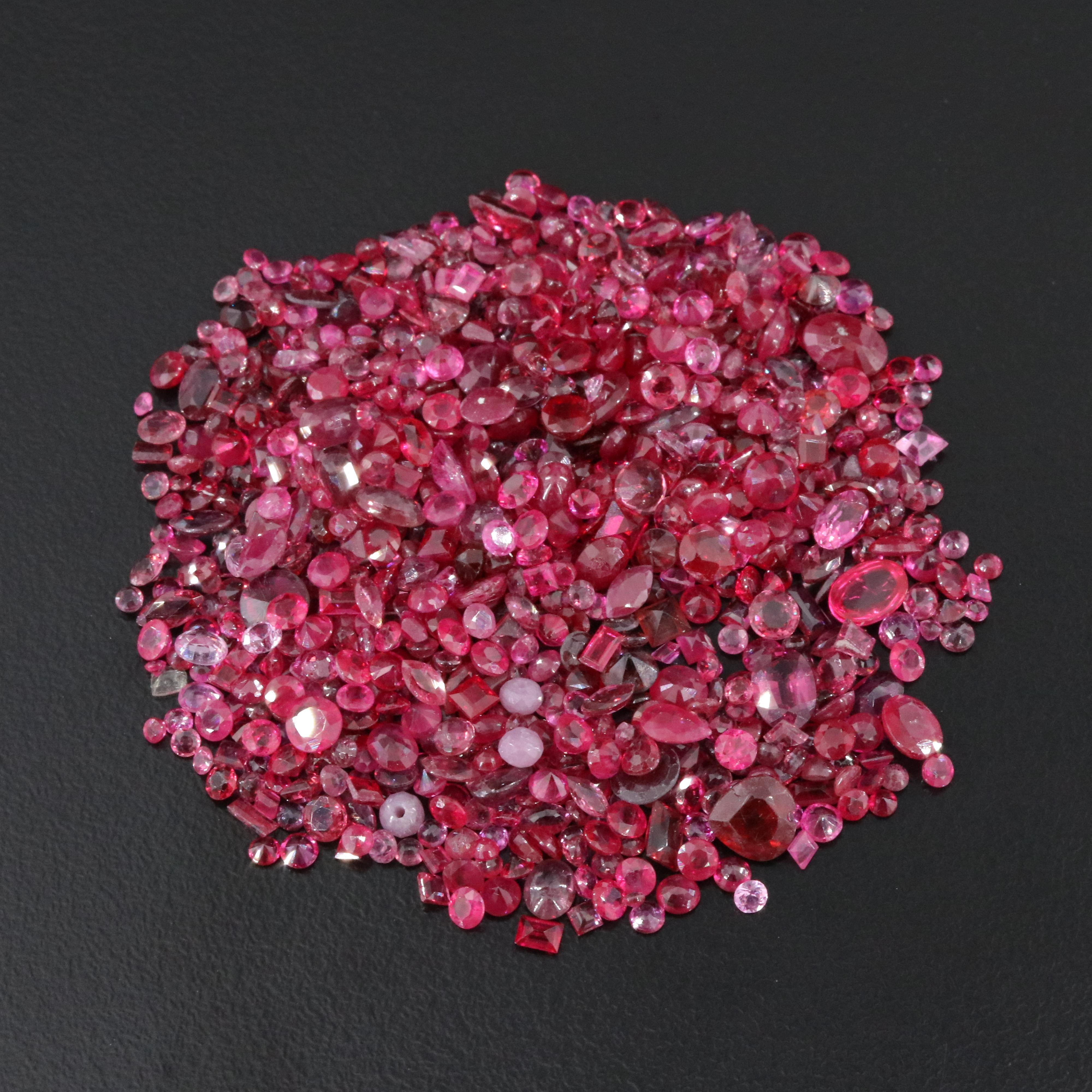 Loose 83.10 CTW Gemstone Lot Including Garnet, Ruby and Sapphire