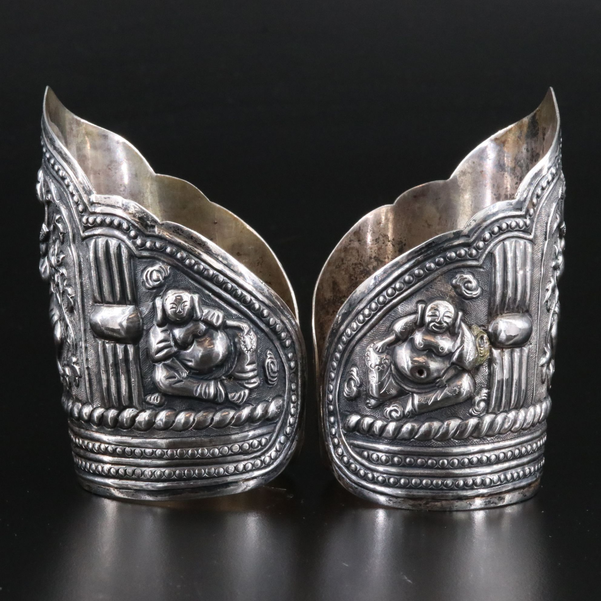Antique Chinese Sterling Pair of Repoussé Buddha and Budai Cuff Bracelets