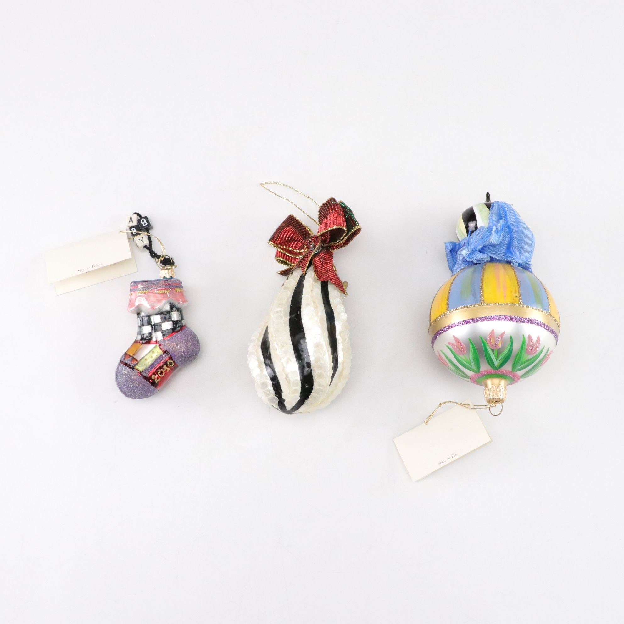 Three MacKenzie-Childs Blown Glass Christmas Ornaments with "First Christmas"