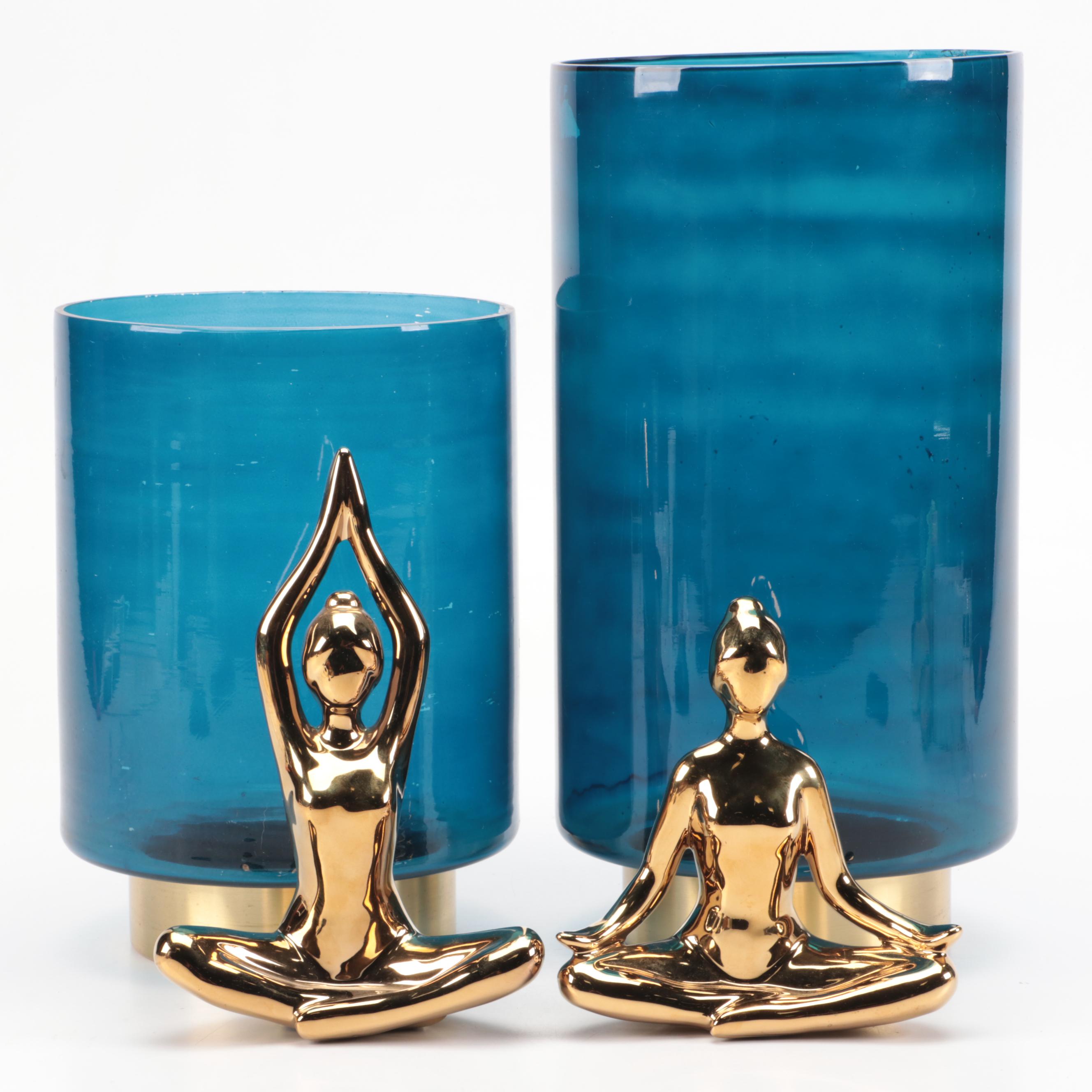 Metallic Base Blue Glass Pillar Candle Holders with Gold Finish Yoga Figures