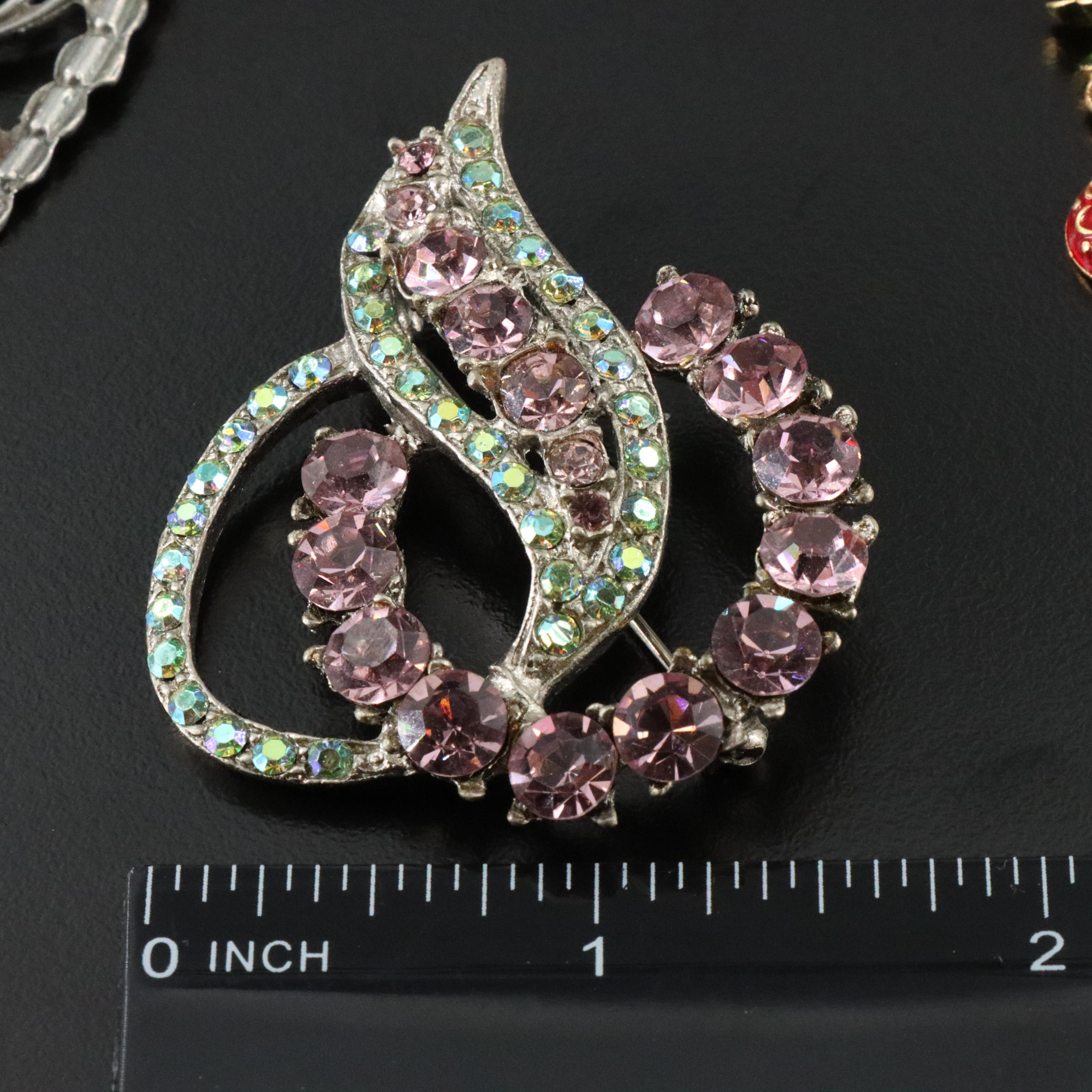 Vintage Brooch Collection Featuring Christmas Theme and Dress Clip