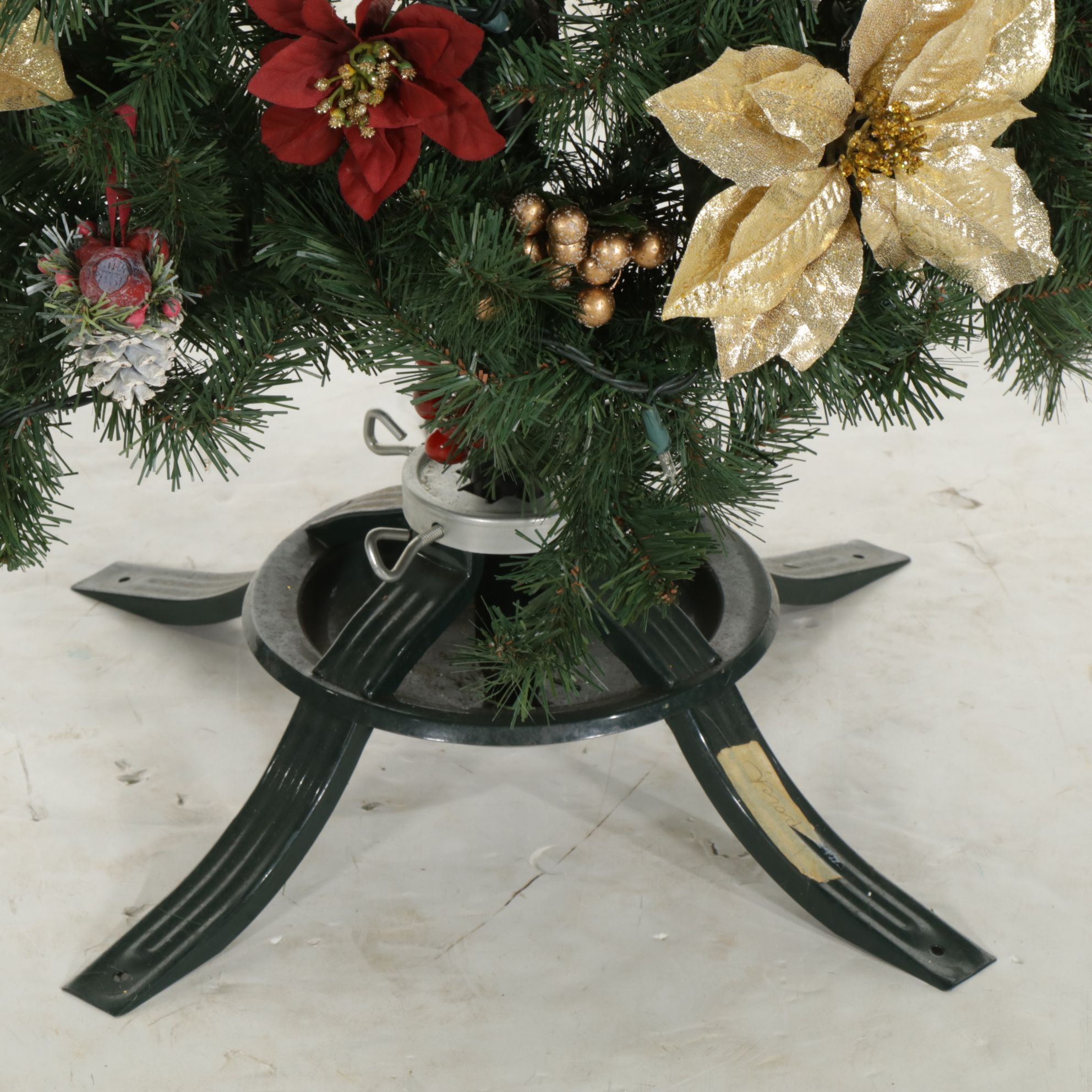 Lighted Artificial Christmas Tree with Poinsettias and Other Ornaments