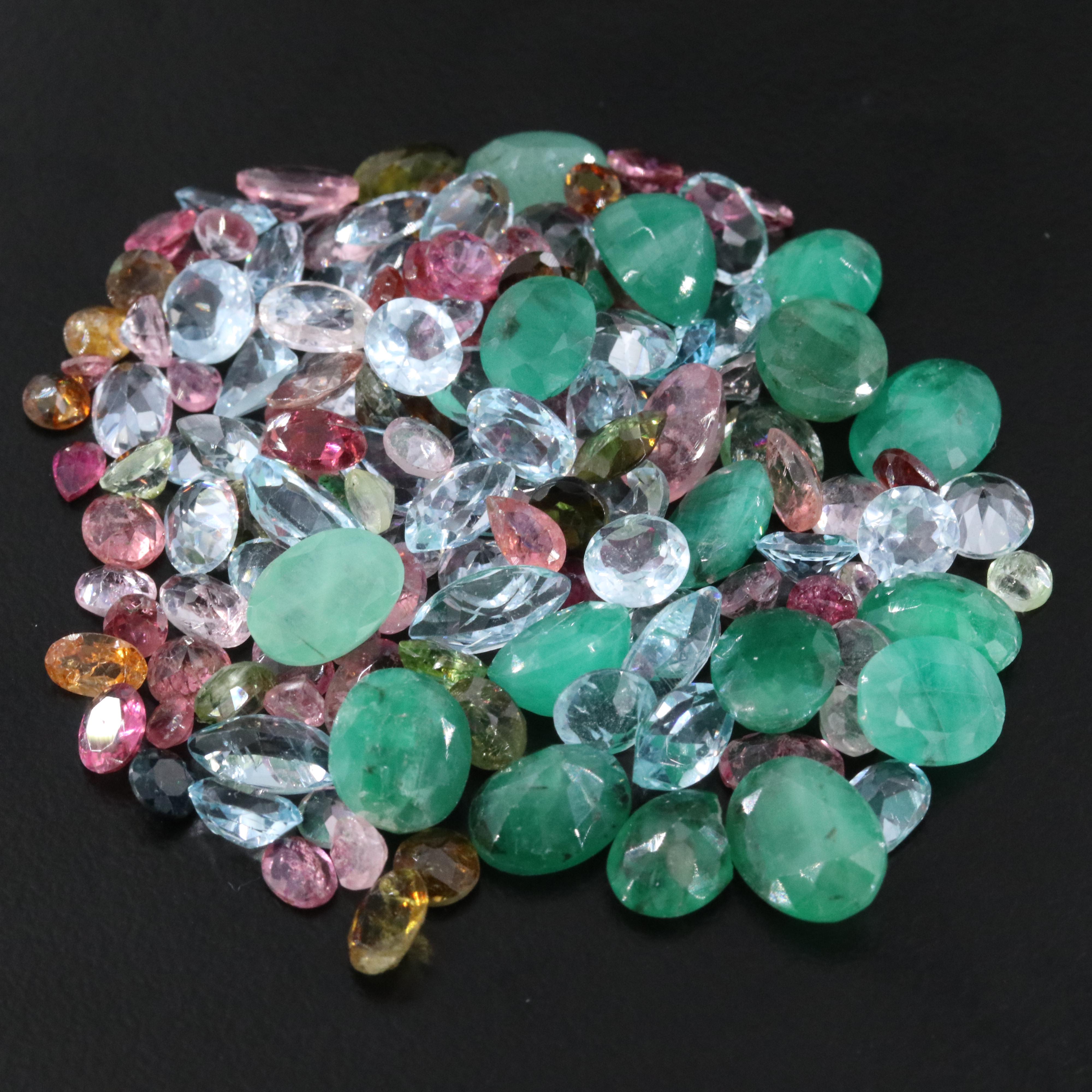 Loose 63.19 CTW Gemstones Including Emerald, Topaz and Tourmaline