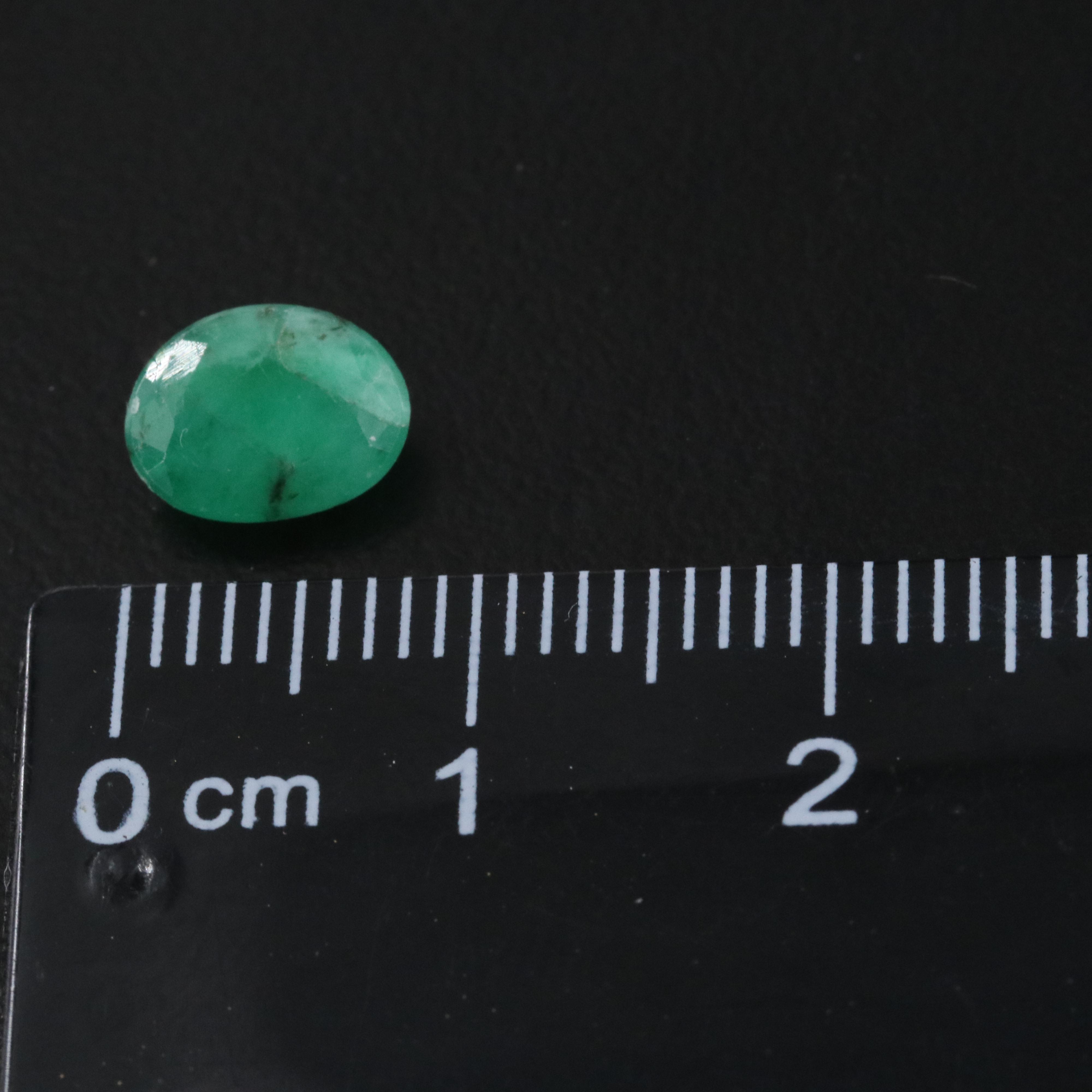 Loose 63.19 CTW Gemstones Including Emerald, Topaz and Tourmaline
