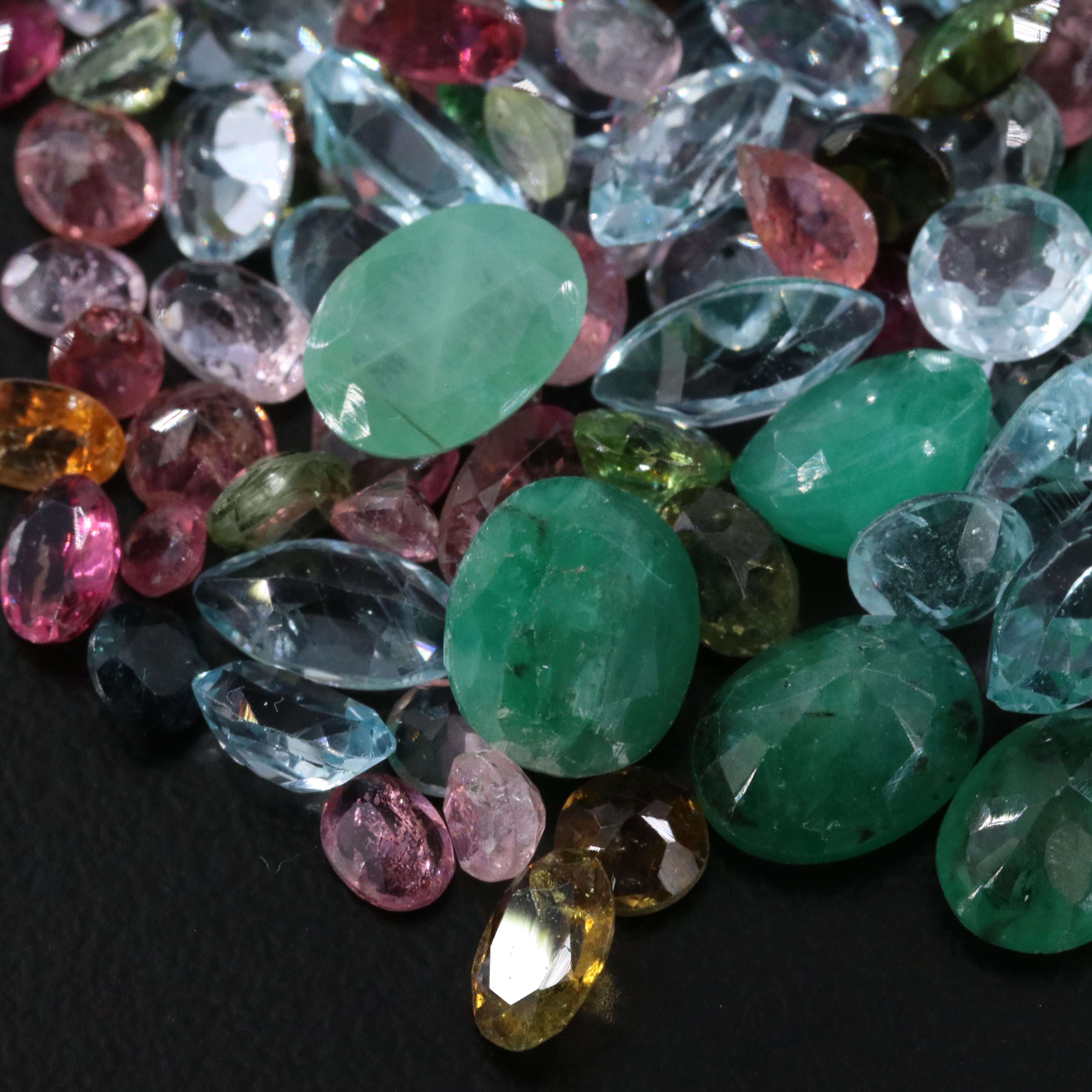 Loose 63.19 CTW Gemstones Including Emerald, Topaz and Tourmaline