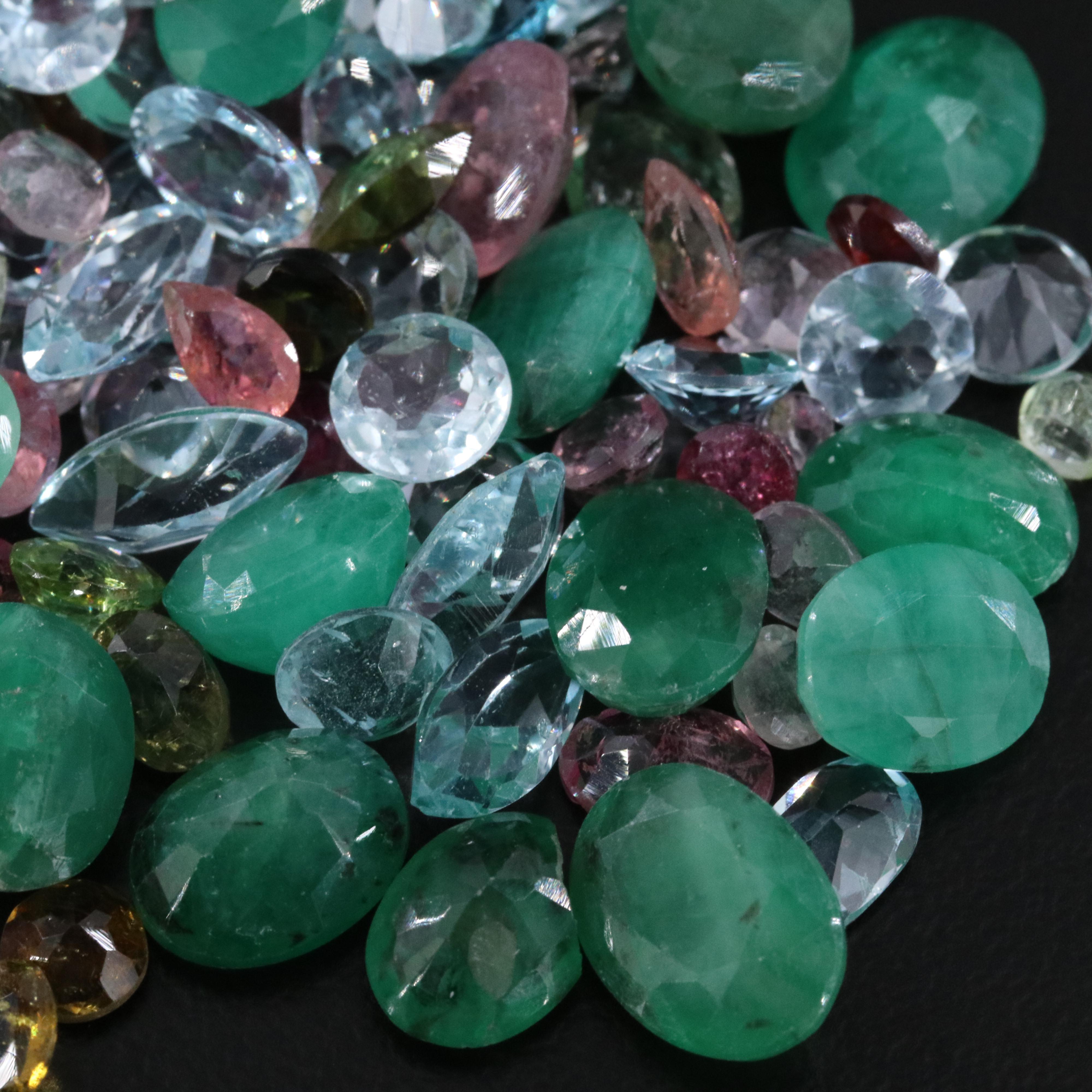 Loose 63.19 CTW Gemstones Including Emerald, Topaz and Tourmaline
