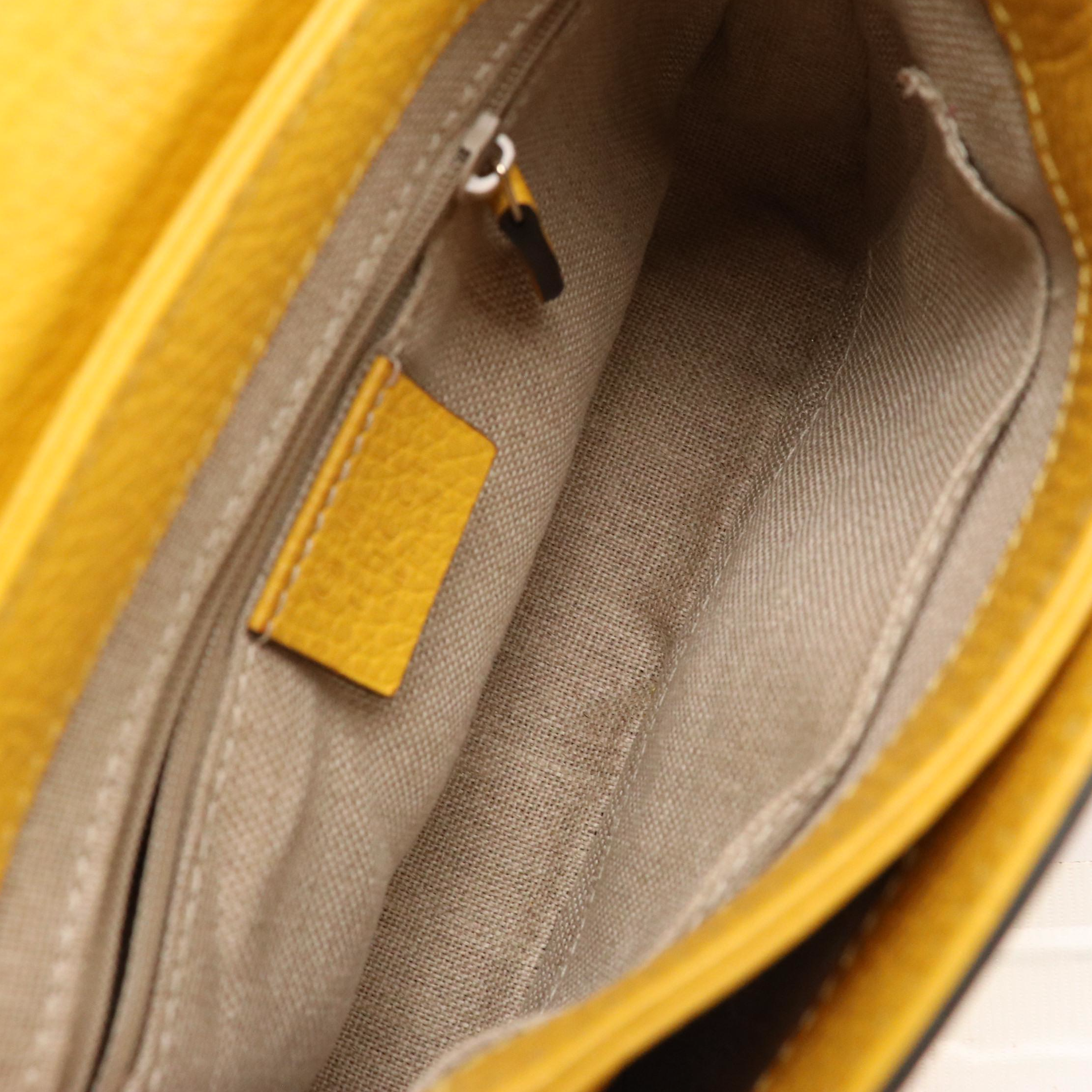 Gucci Interlocking GG Dollar Shoulder Bag in Yellow Grained Leather