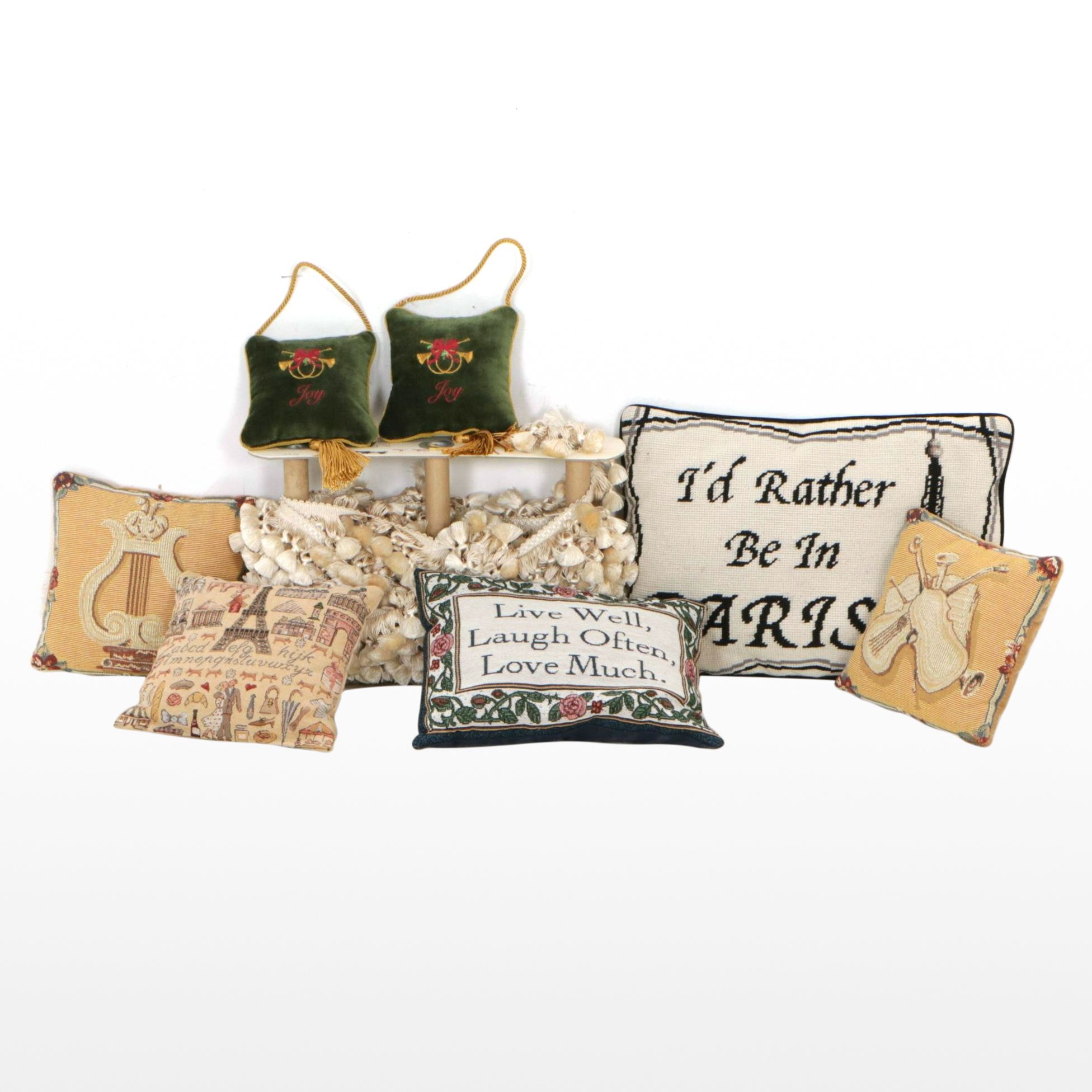 Decorative Pillows with Quotes and Motifs and Roll of Fringed Tassels