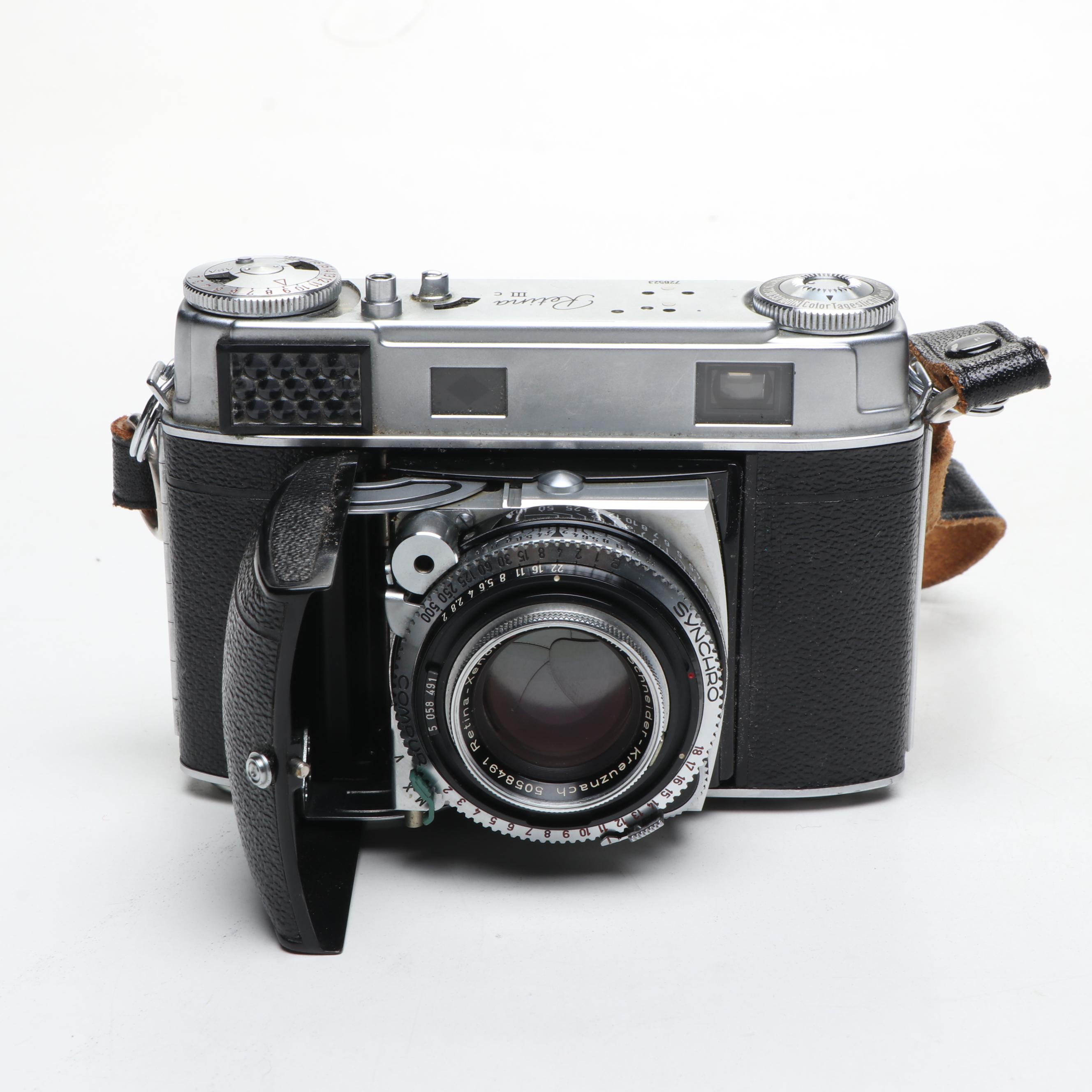 Nikon EL, Yashica-U Matic, and Kodak Retina IIIc Cameras with Lenses