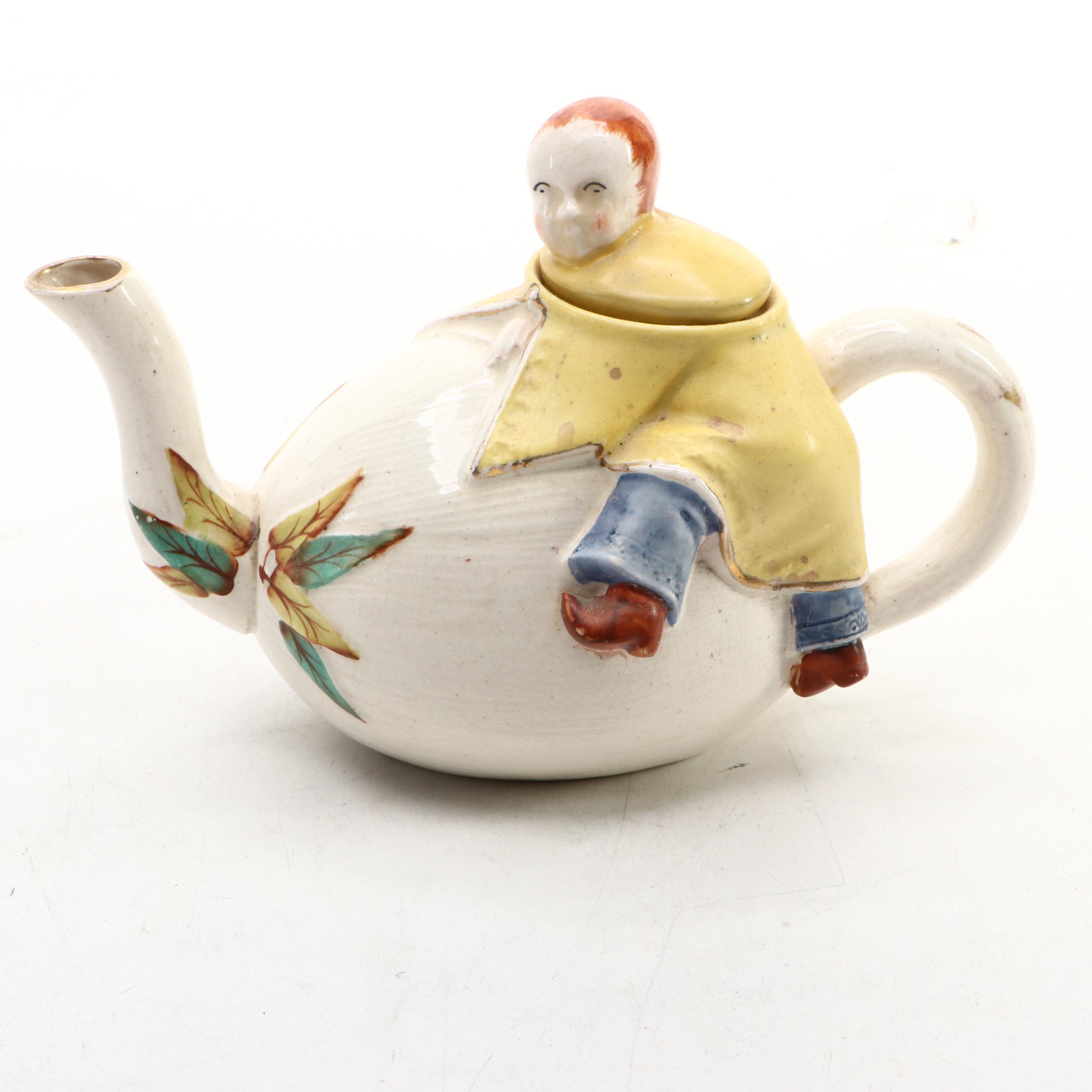 Japanese Banko with English Majolica Figural Teapots and Man in the Moon Jug