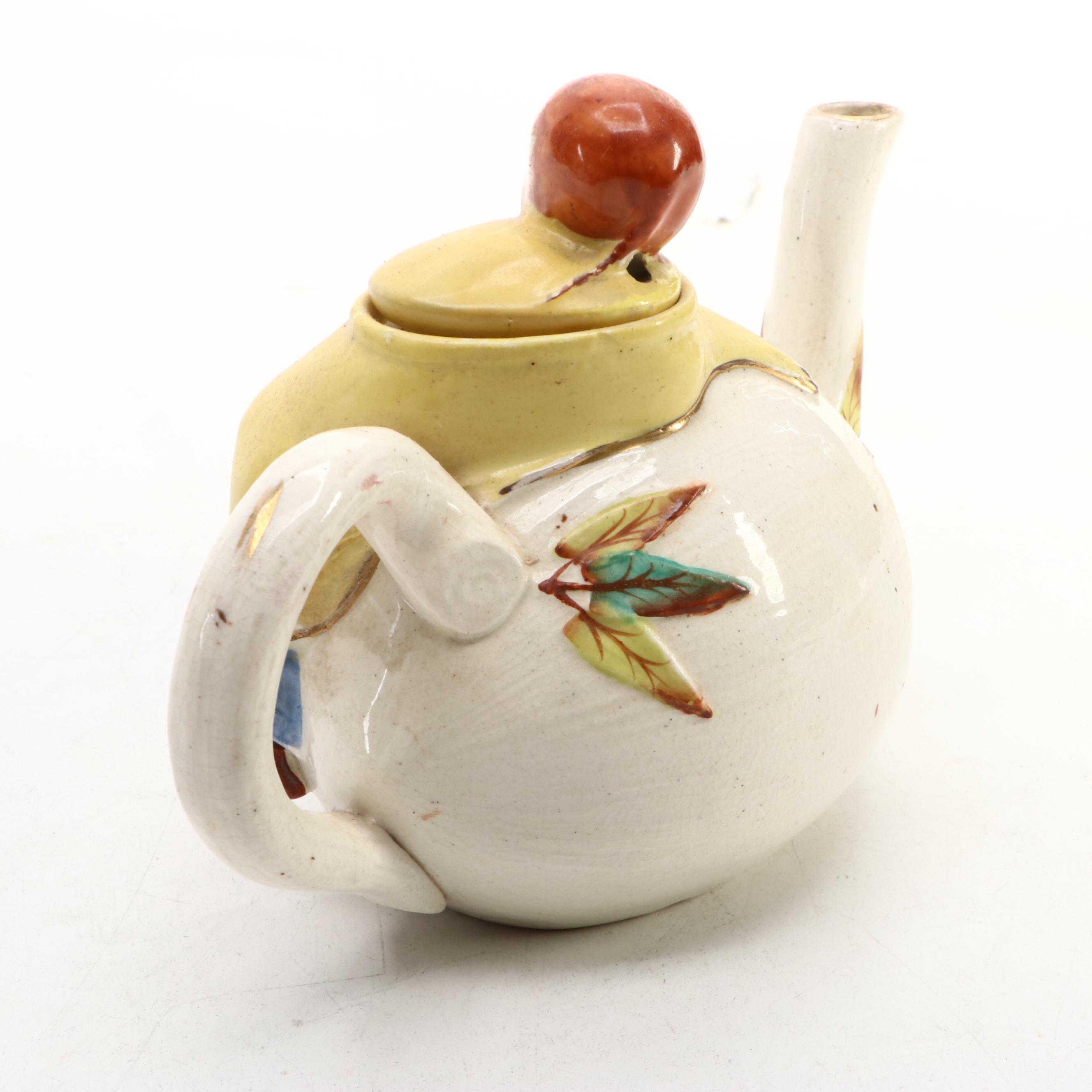 Japanese Banko with English Majolica Figural Teapots and Man in the Moon Jug