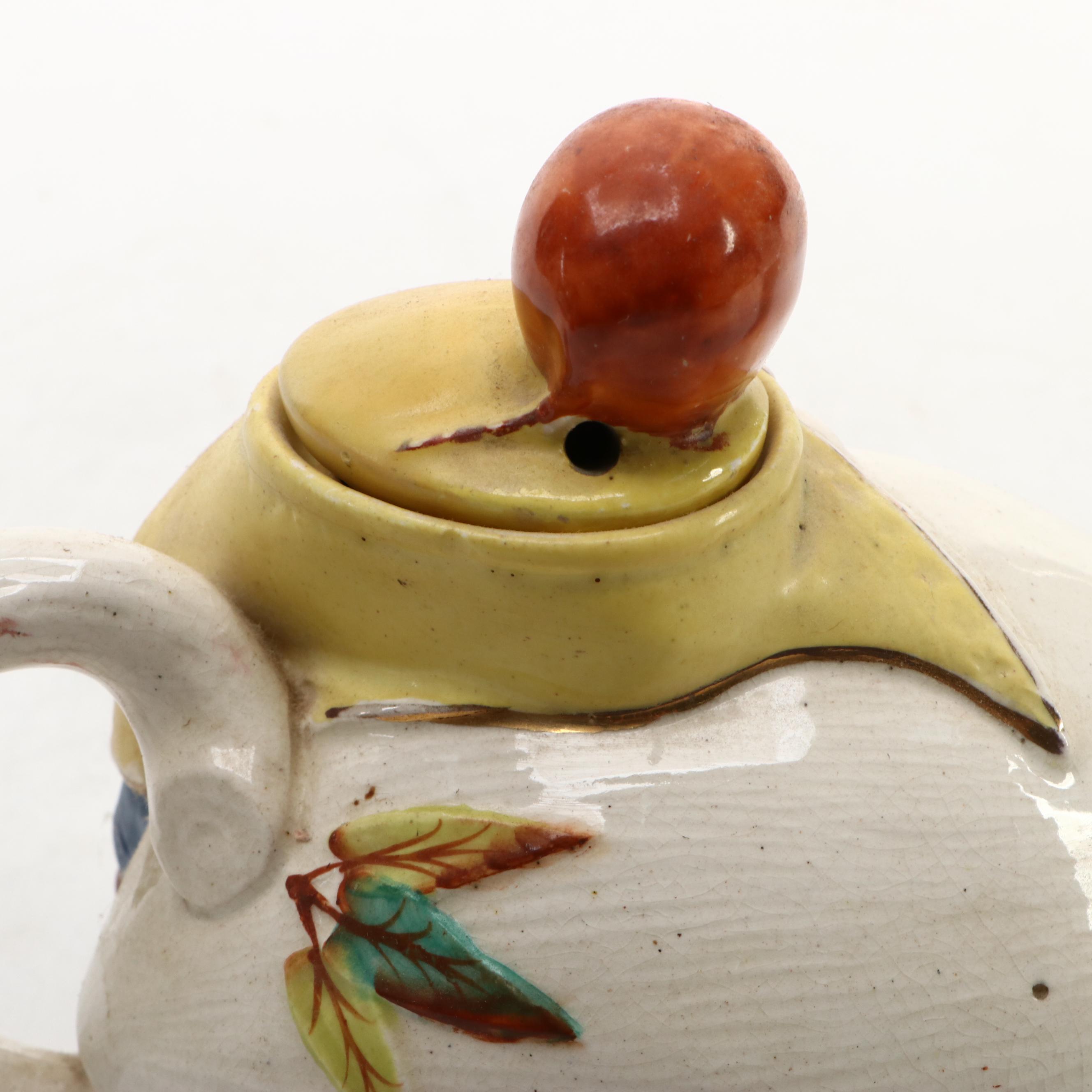 Japanese Banko with English Majolica Figural Teapots and Man in the Moon Jug