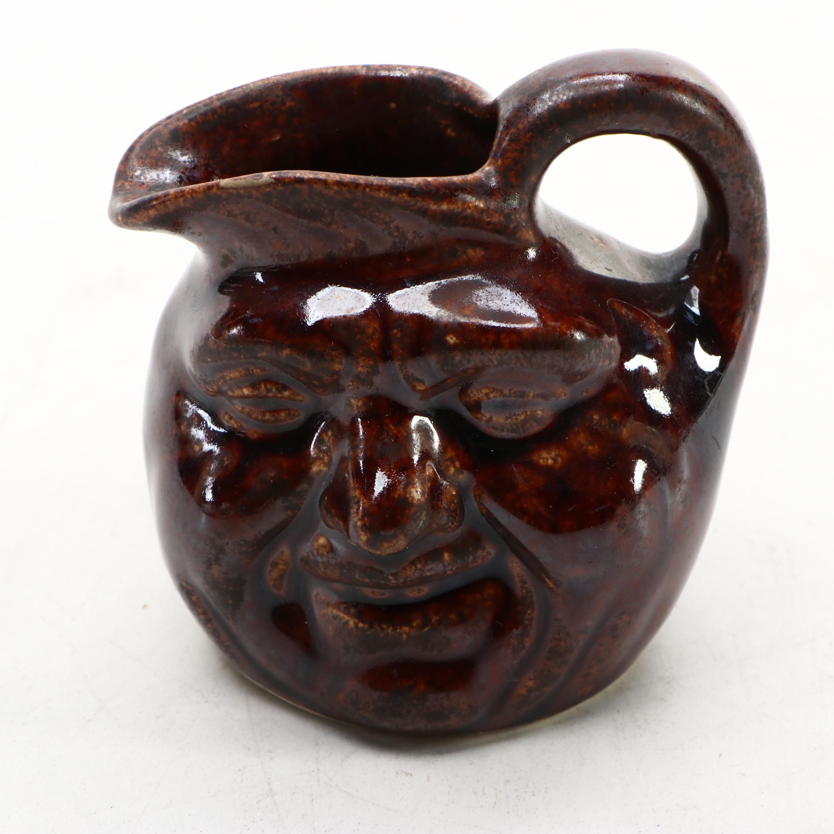 Japanese Banko with English Majolica Figural Teapots and Man in the Moon Jug