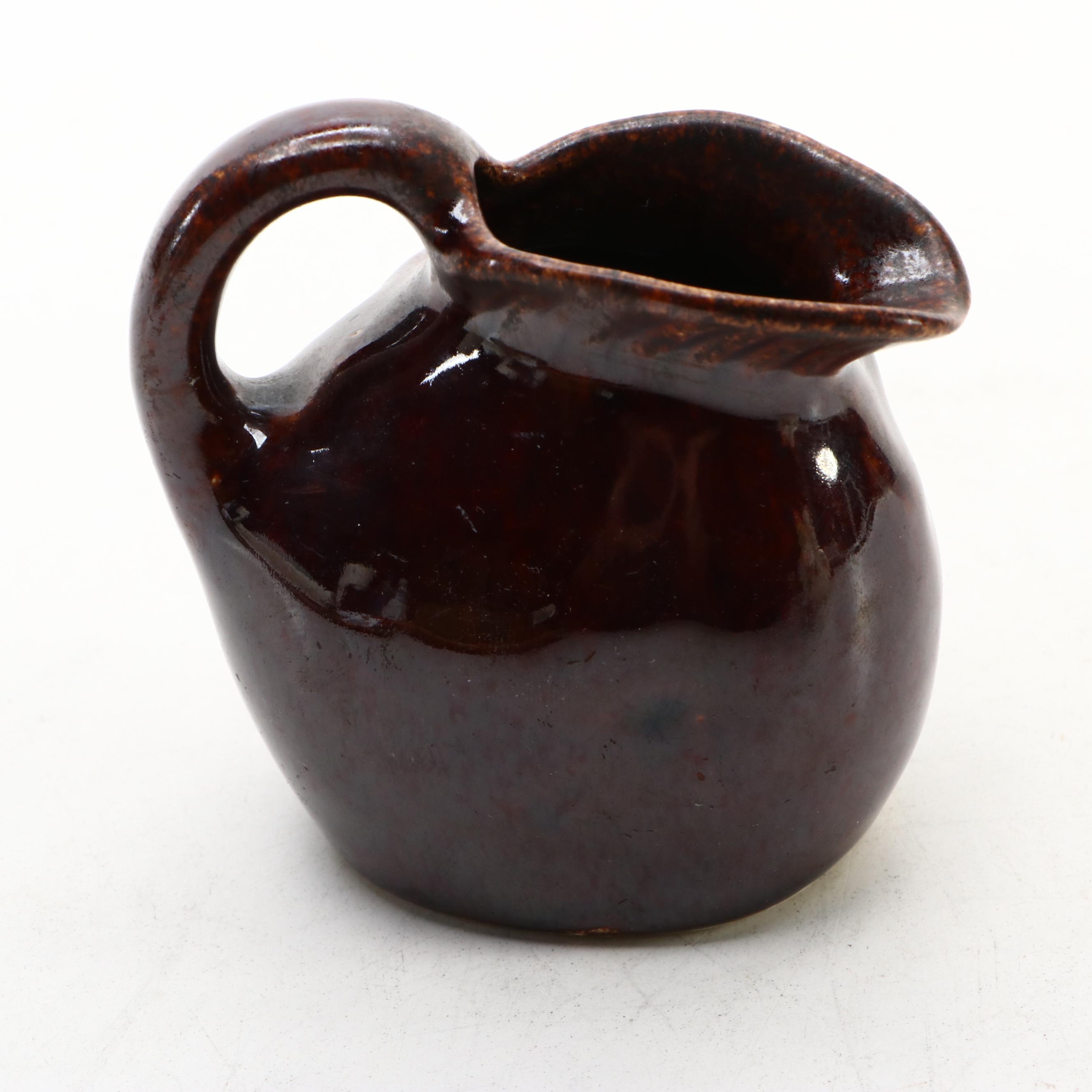 Japanese Banko with English Majolica Figural Teapots and Man in the Moon Jug