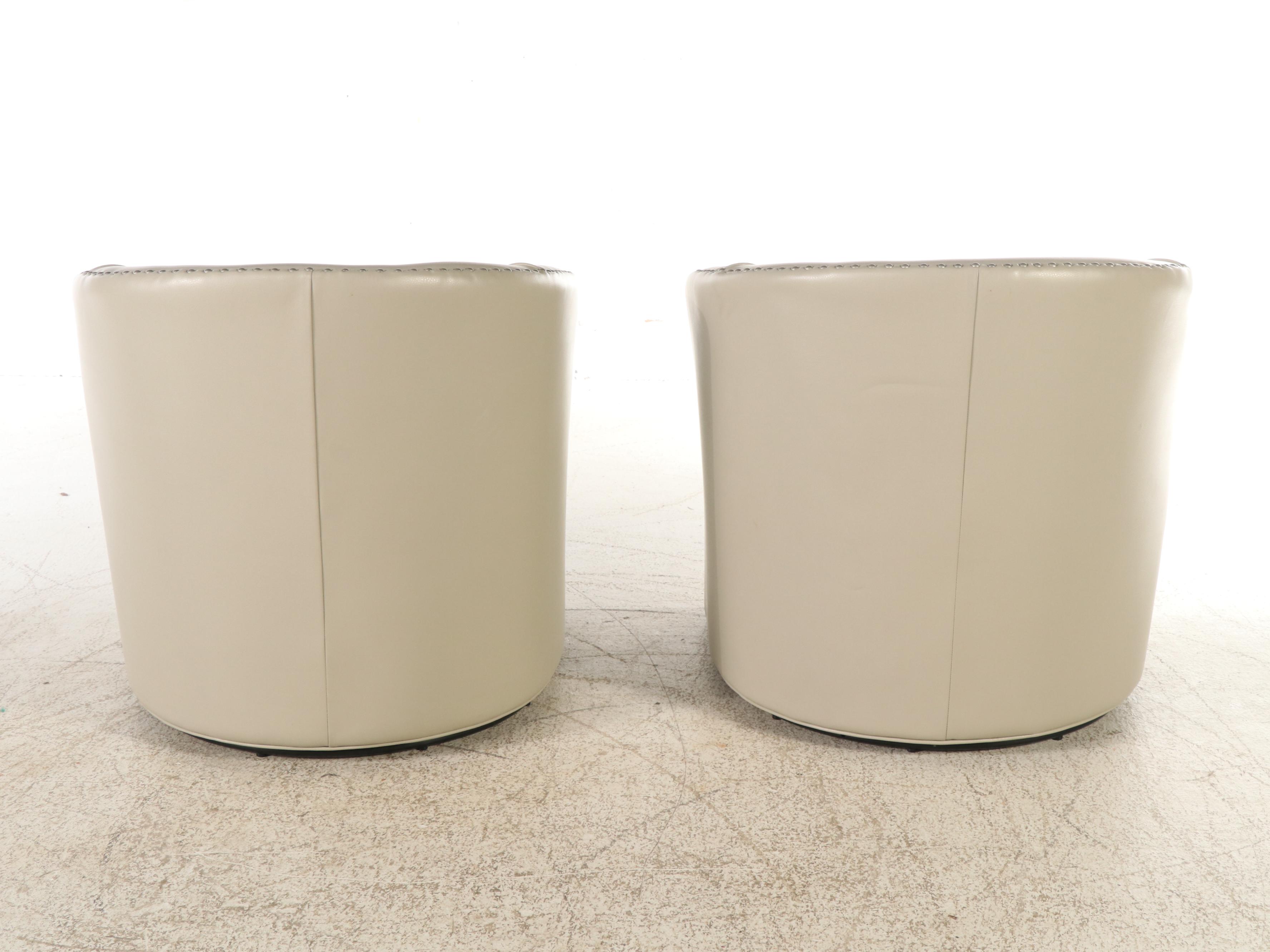 Pair of Modern Faux Leather Swivel Armchairs