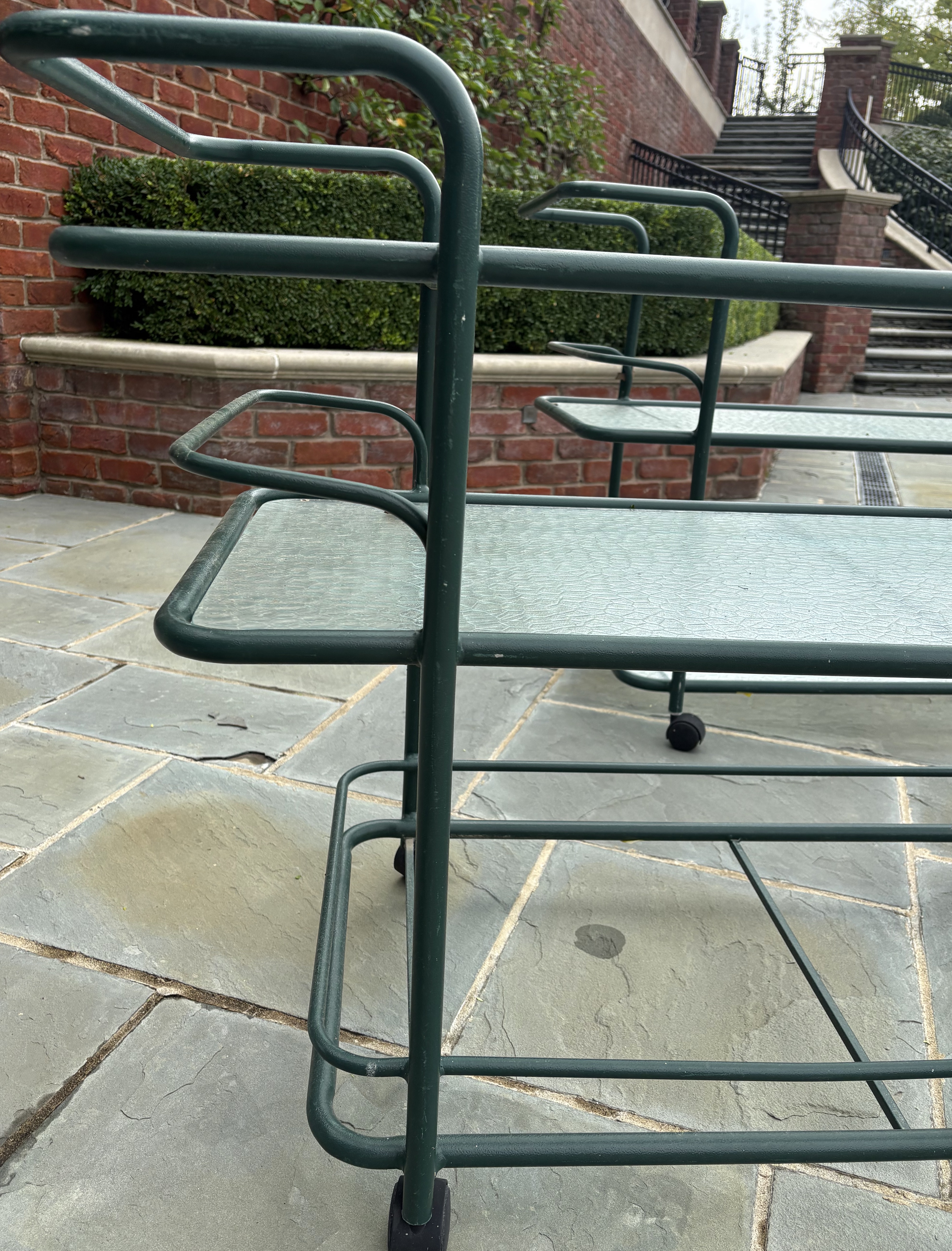 Pair of Hunter Green Tubular Metal Serving Carts with Textured Glass Shelves
