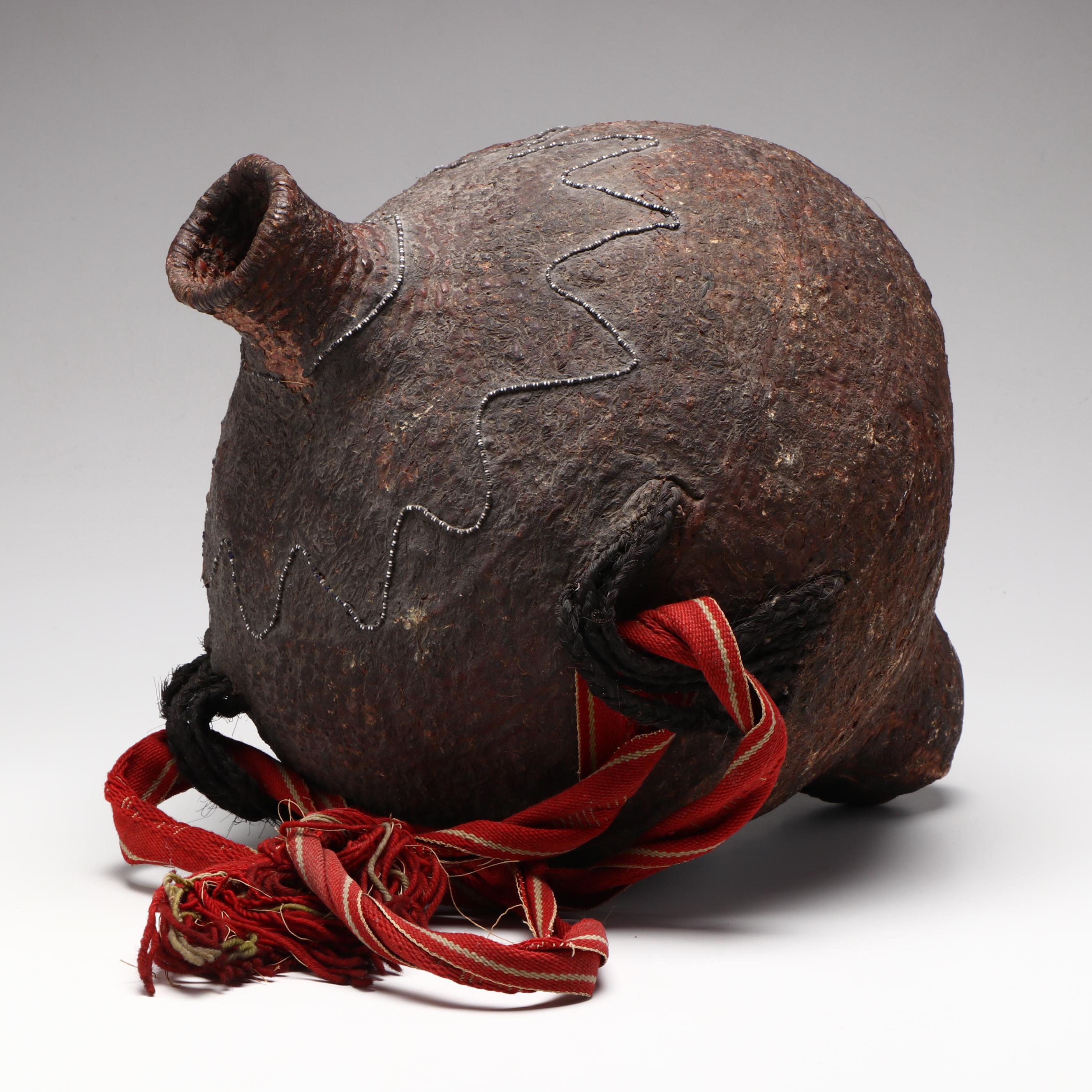 Indé (Apache) Pitch Water Jug with Patterned Seed Beads and Woven Strap