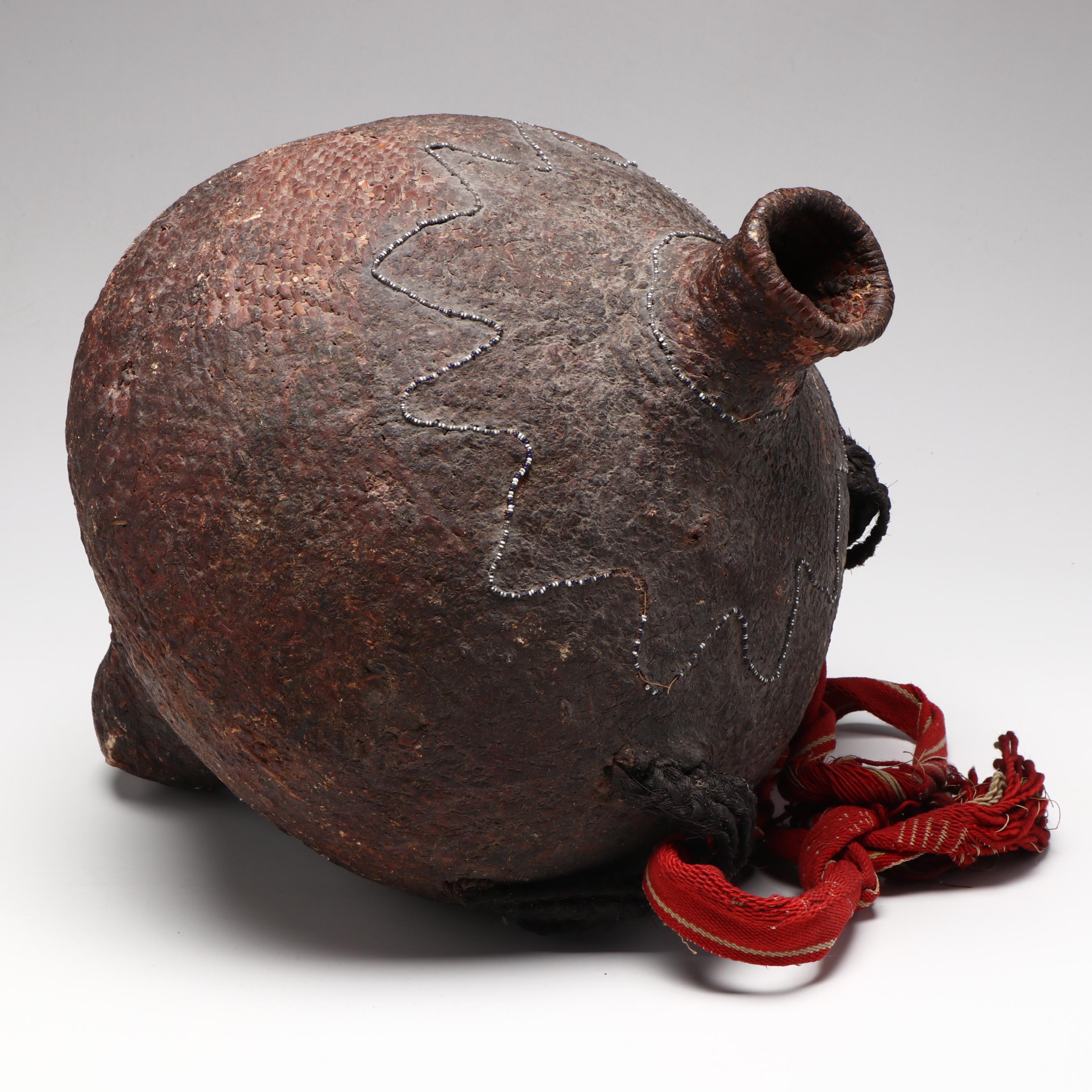 Indé (Apache) Pitch Water Jug with Patterned Seed Beads and Woven Strap