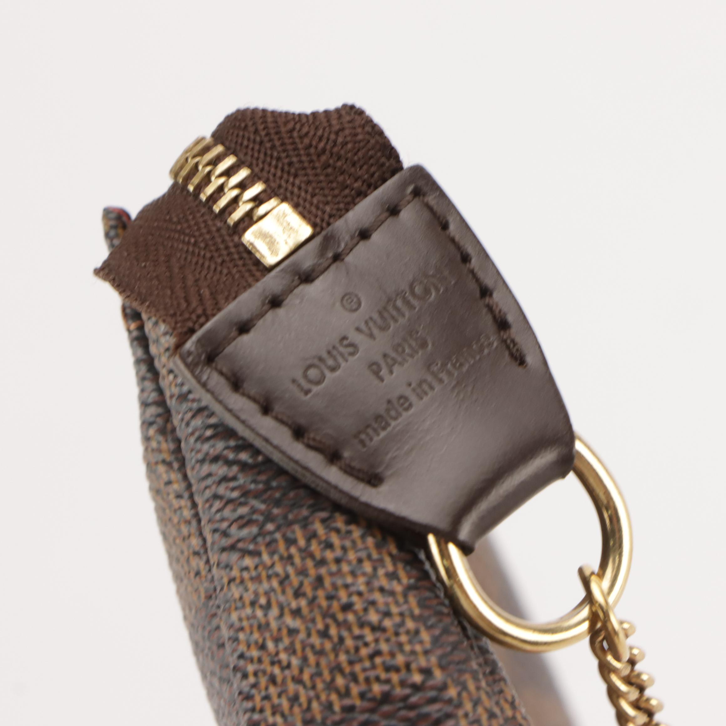 Louis Vuitton Mini Pochette Accessoires in Damier Ebene Canvas