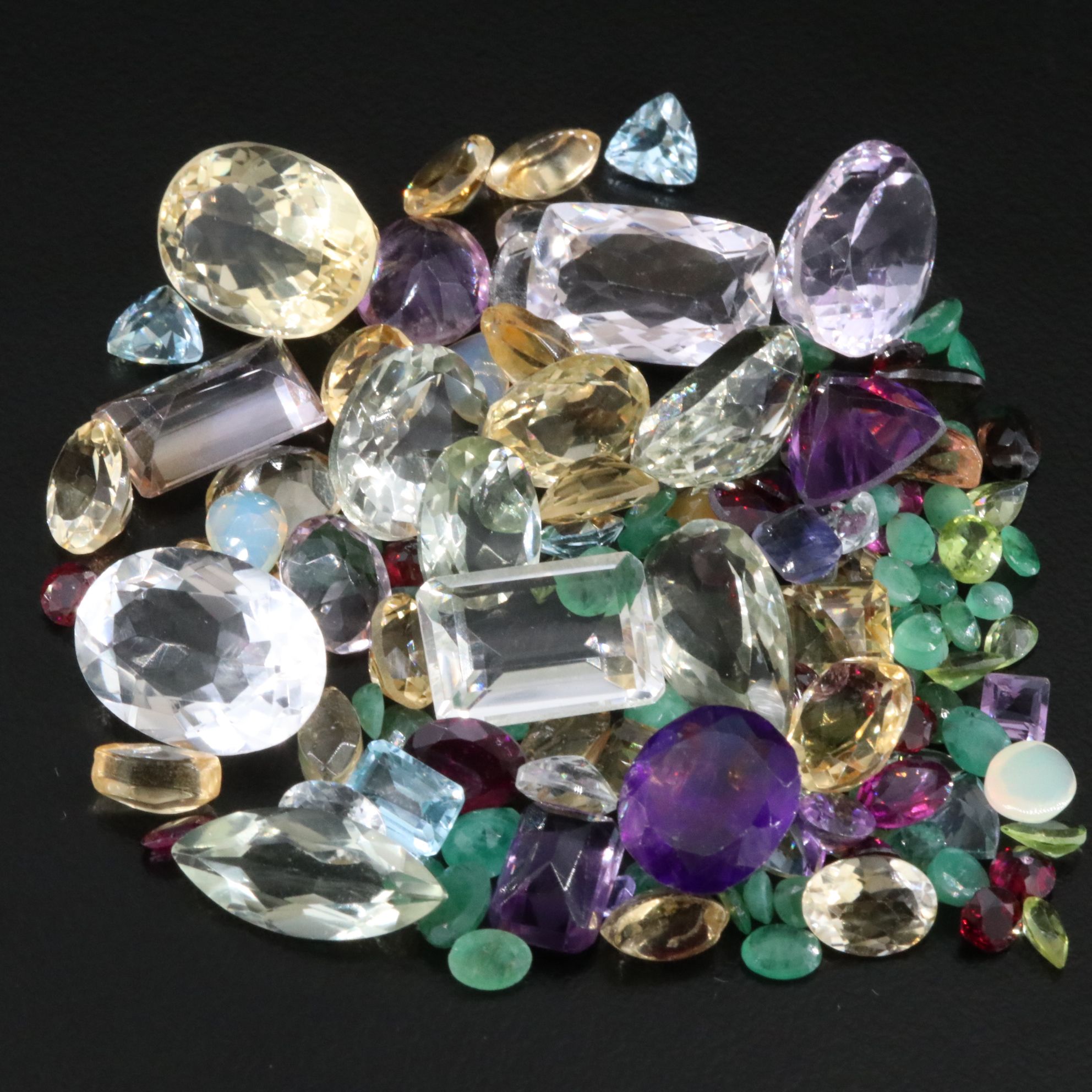 Loose 149.37 CTW Gemstone Lot Including Emerald, Garnet and Amethyst