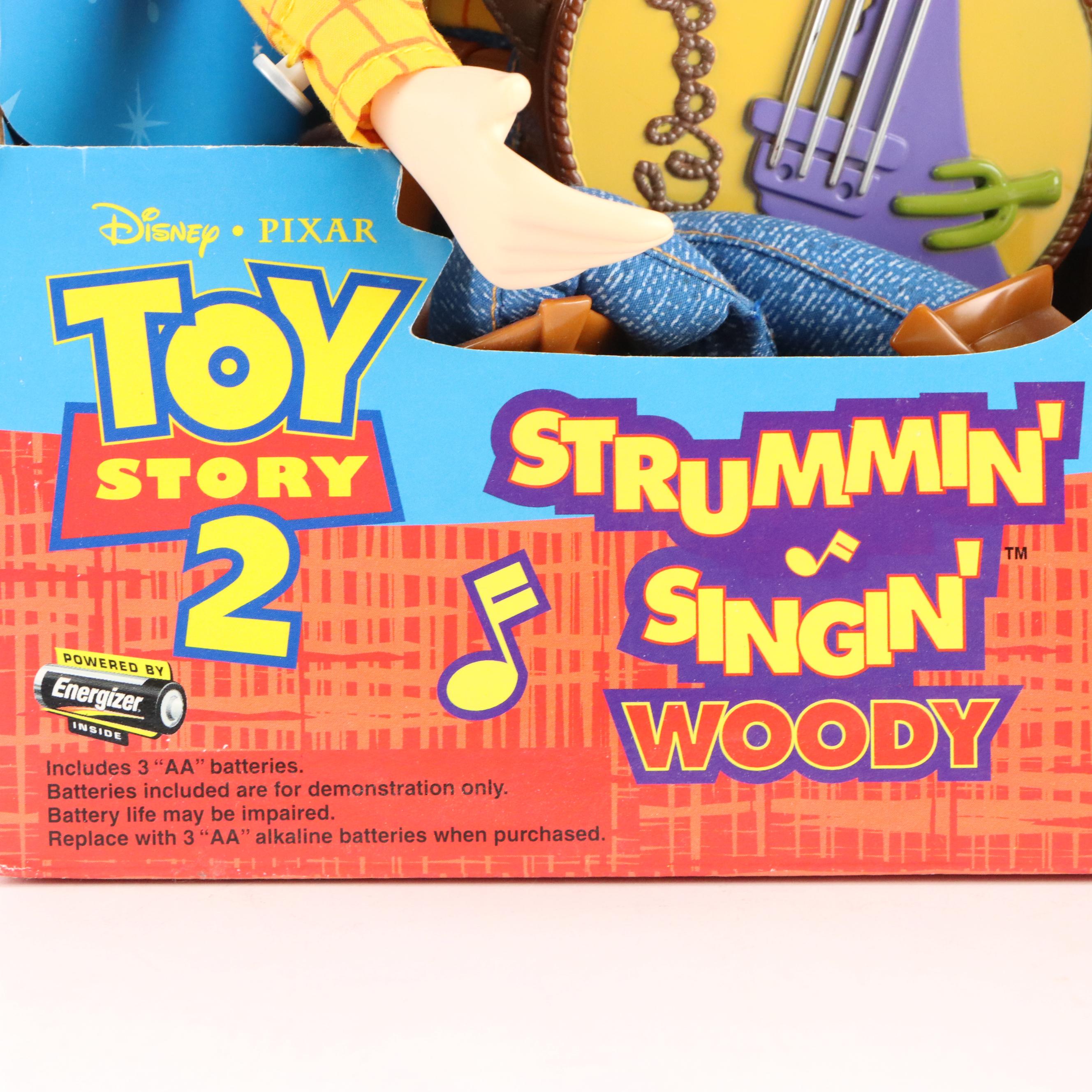 Toy Story 2 Strummin' Singin' Woody, Winnie the Pooh Bear, and Teddy Ruxpin