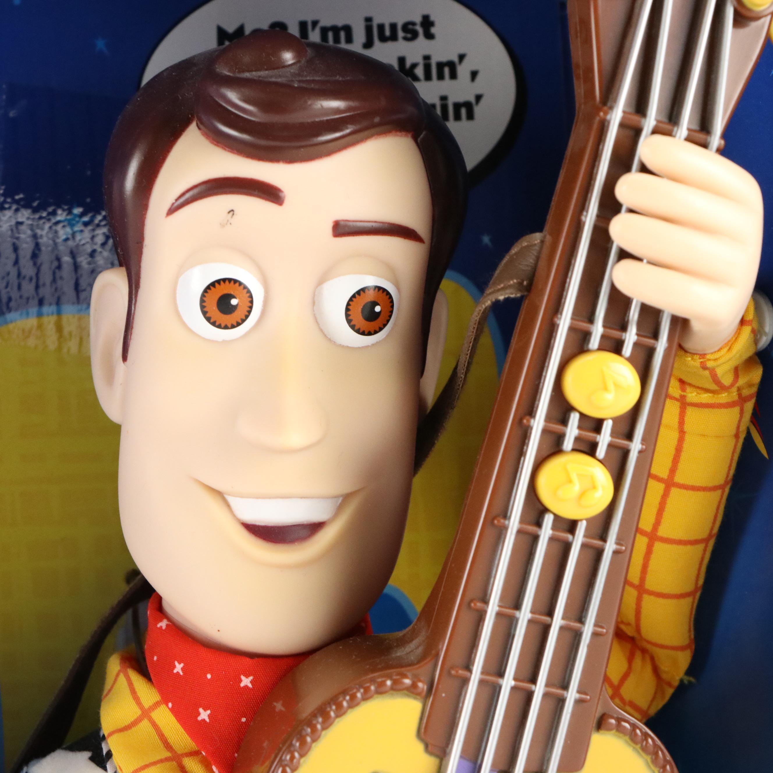 Toy Story 2 Strummin' Singin' Woody, Winnie the Pooh Bear, and Teddy Ruxpin