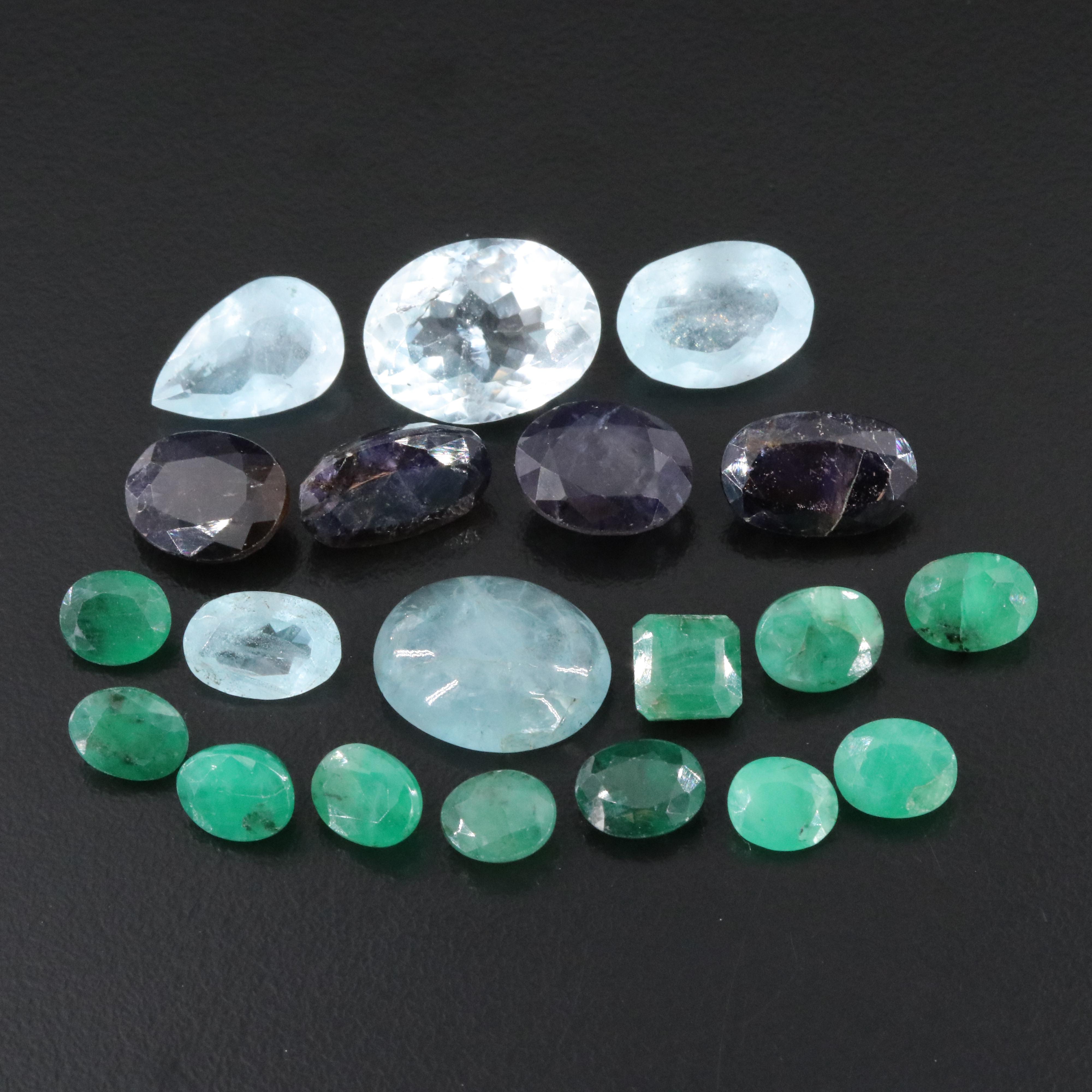 Loose 68.57 CTW Gemstone Lot Including Topaz, Emerald and Iolite