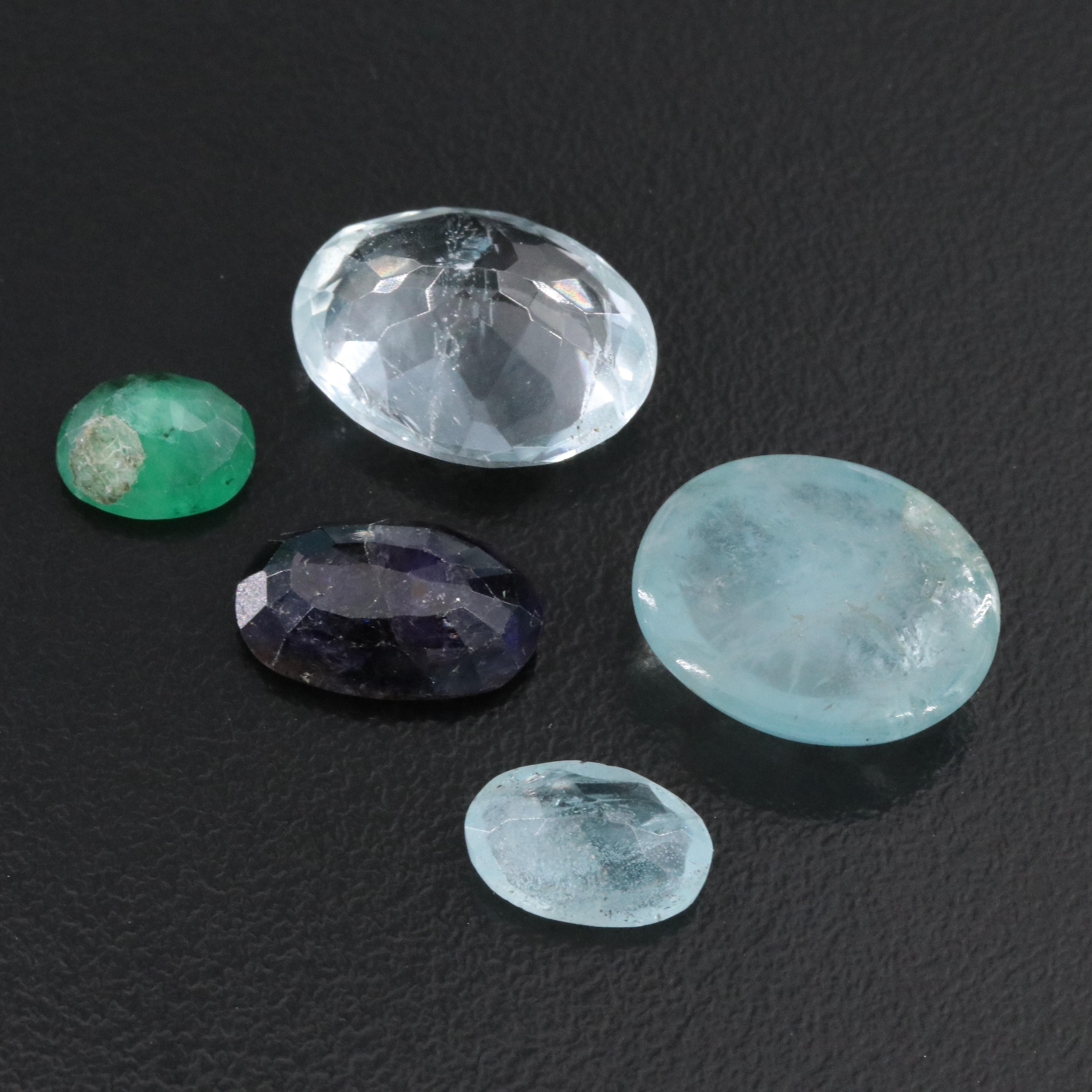 Loose 68.57 CTW Gemstone Lot Including Topaz, Emerald and Iolite