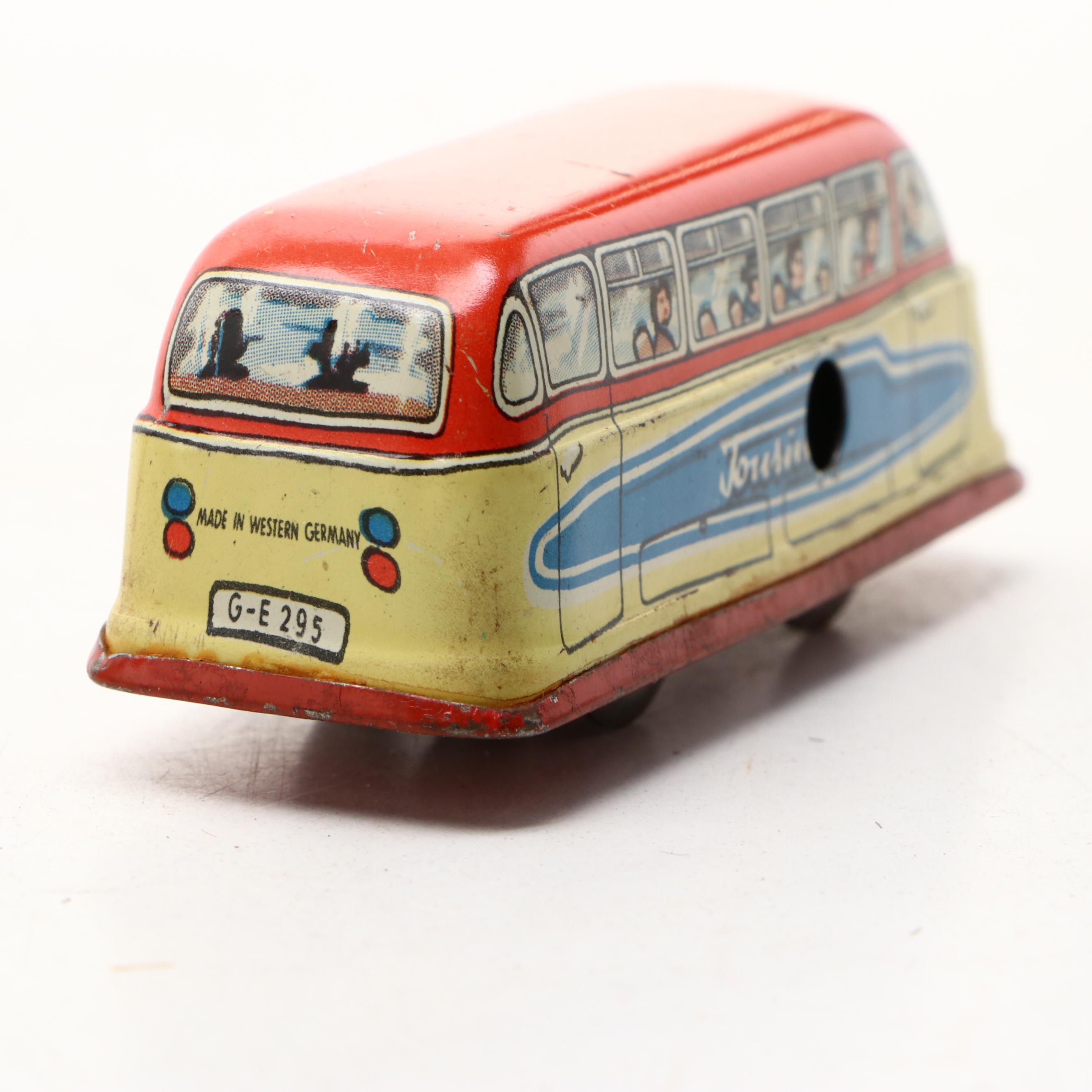 Studebaker Tin Wind-Up Car with More Vintage Toy Cars and Boat