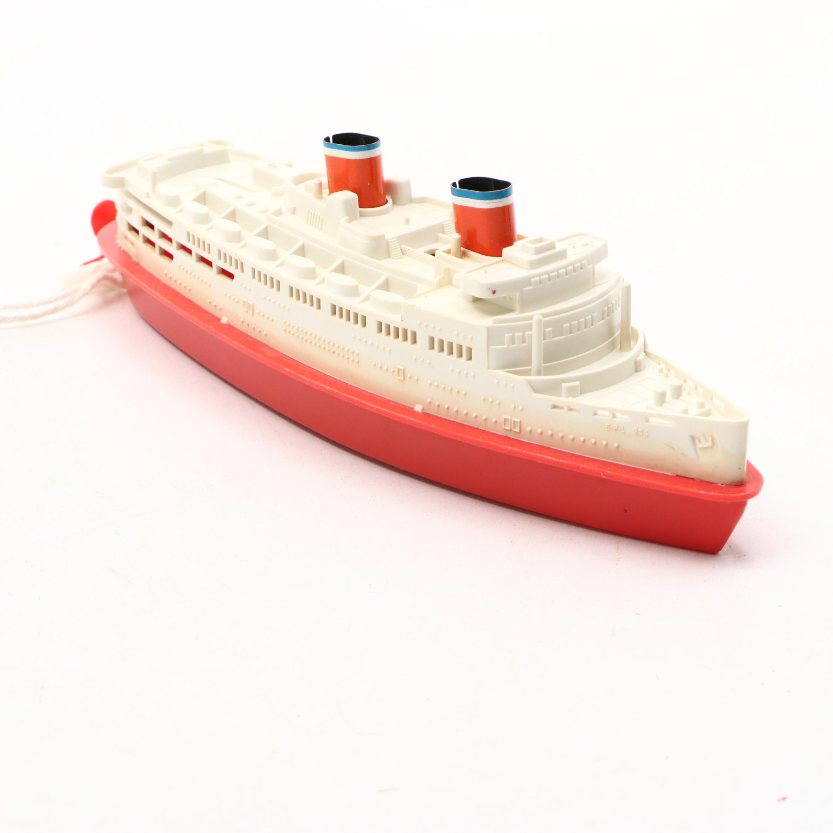 Studebaker Tin Wind-Up Car with More Vintage Toy Cars and Boat