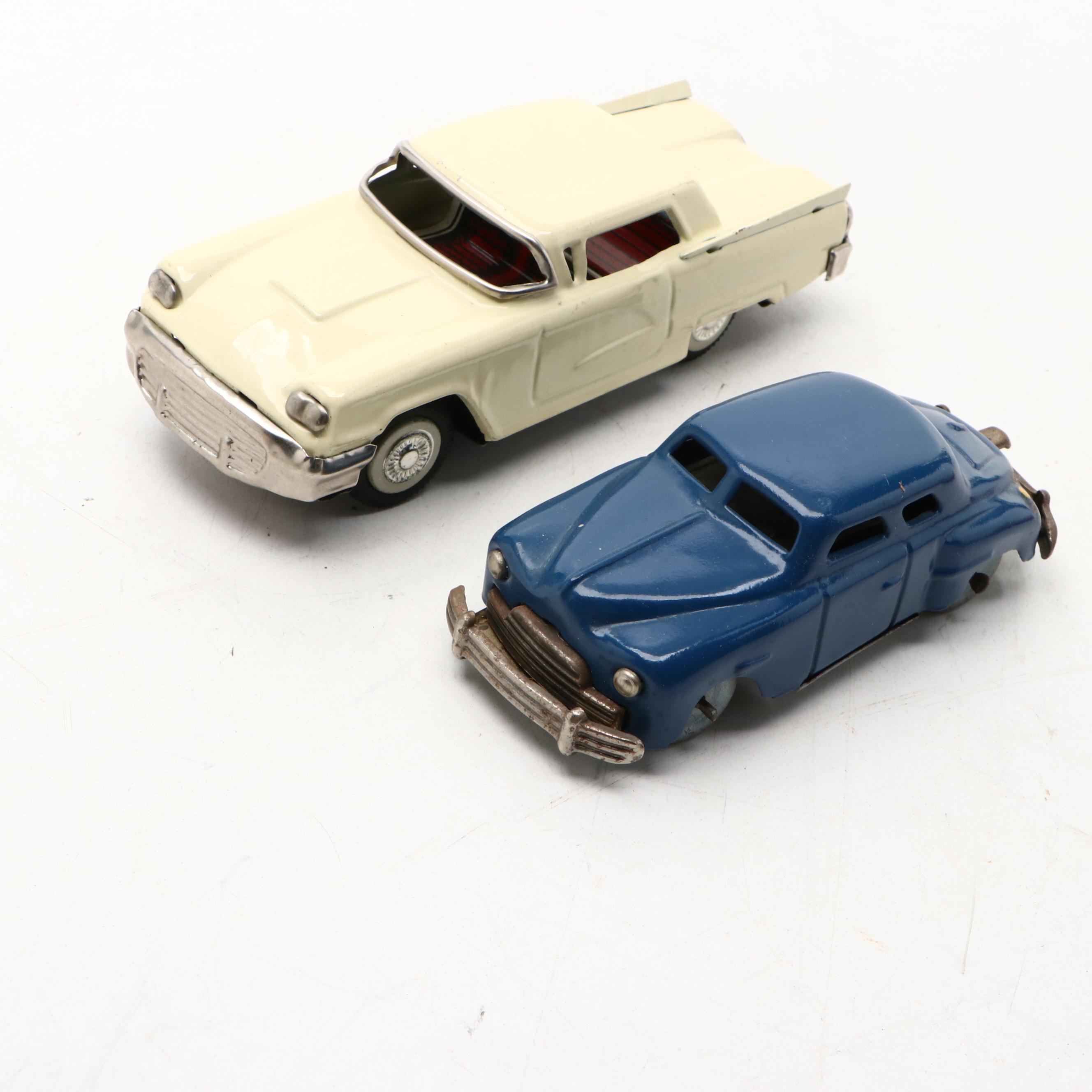 Studebaker Tin Wind-Up Car with More Vintage Toy Cars and Boat