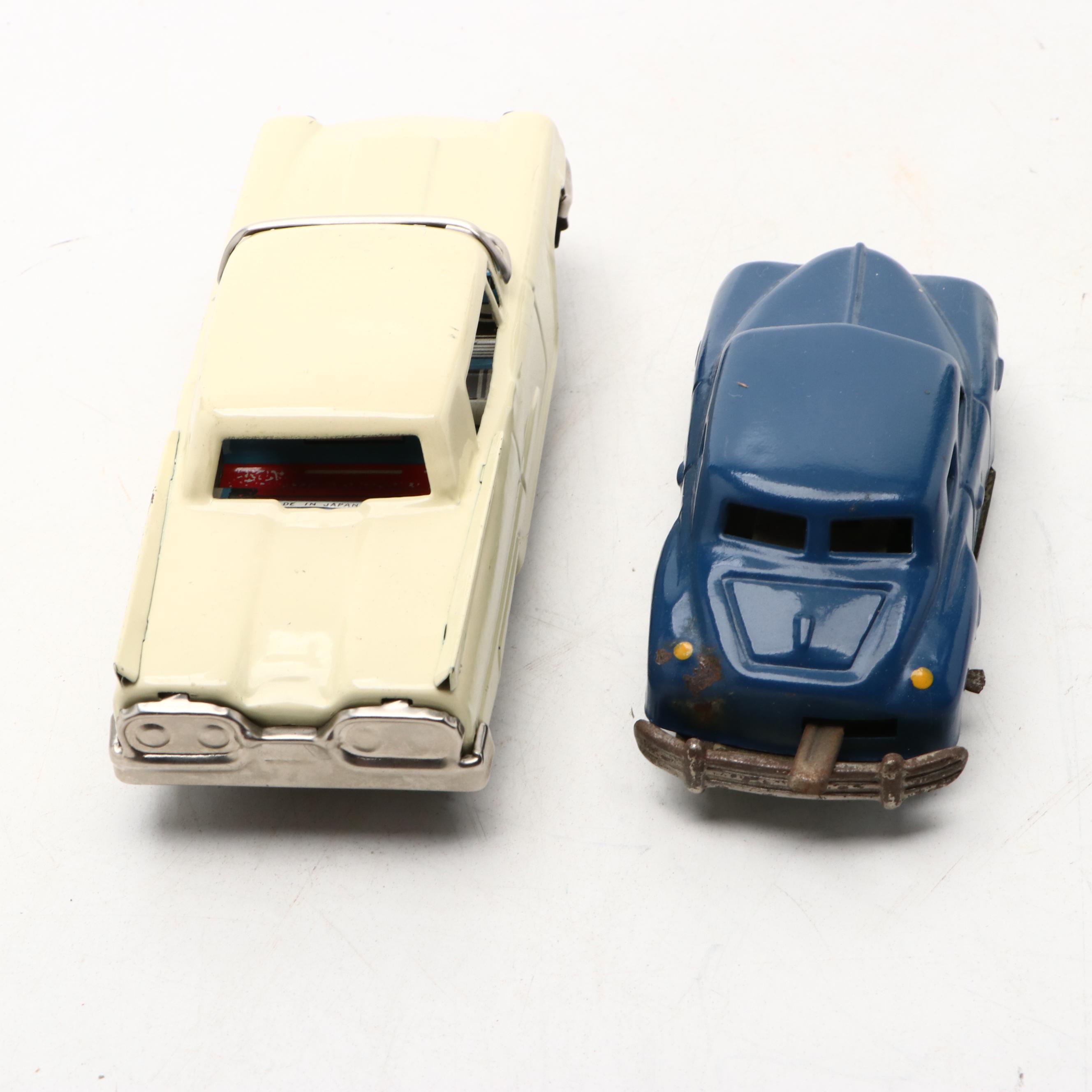 Studebaker Tin Wind-Up Car with More Vintage Toy Cars and Boat