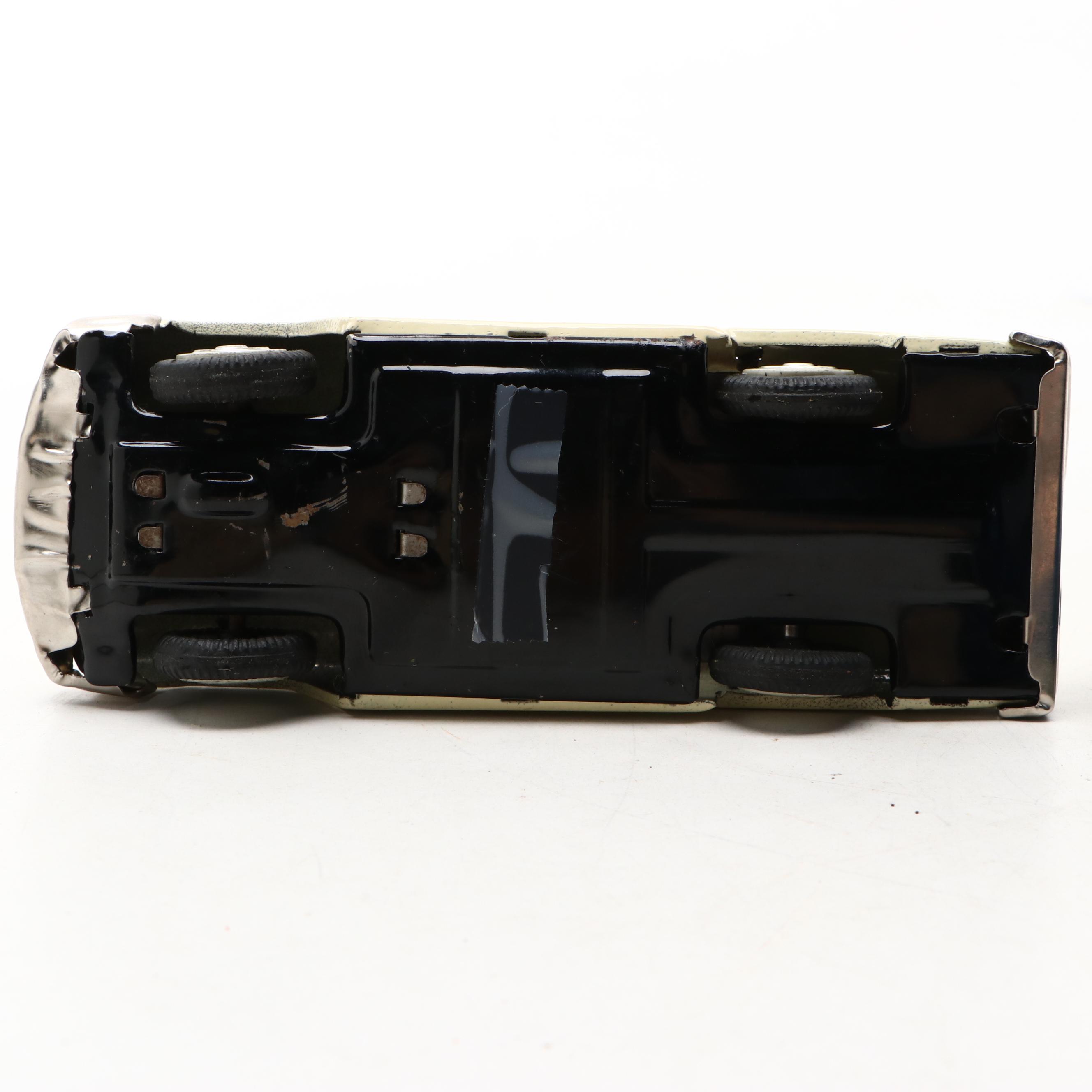 Studebaker Tin Wind-Up Car with More Vintage Toy Cars and Boat