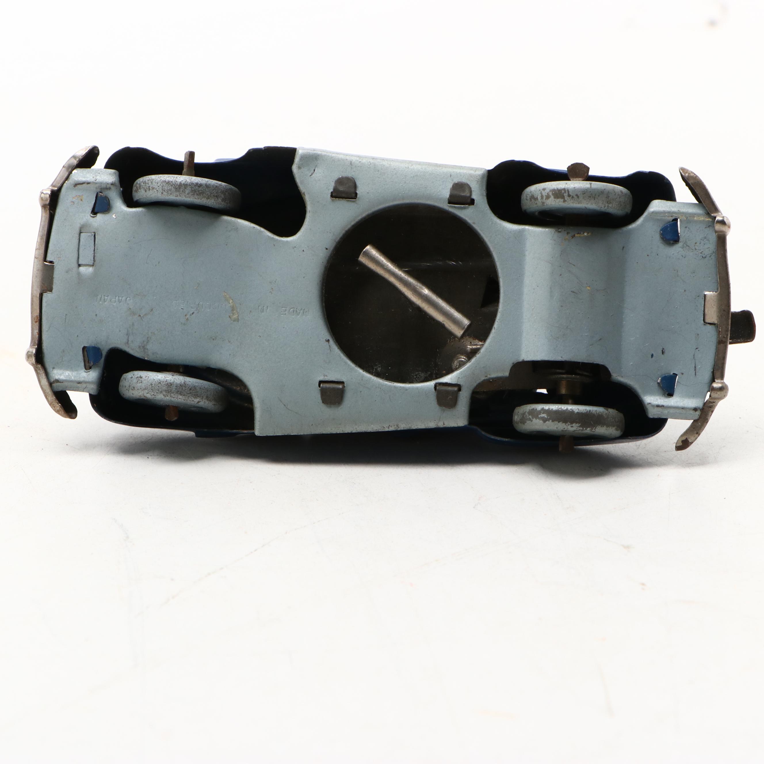 Studebaker Tin Wind-Up Car with More Vintage Toy Cars and Boat