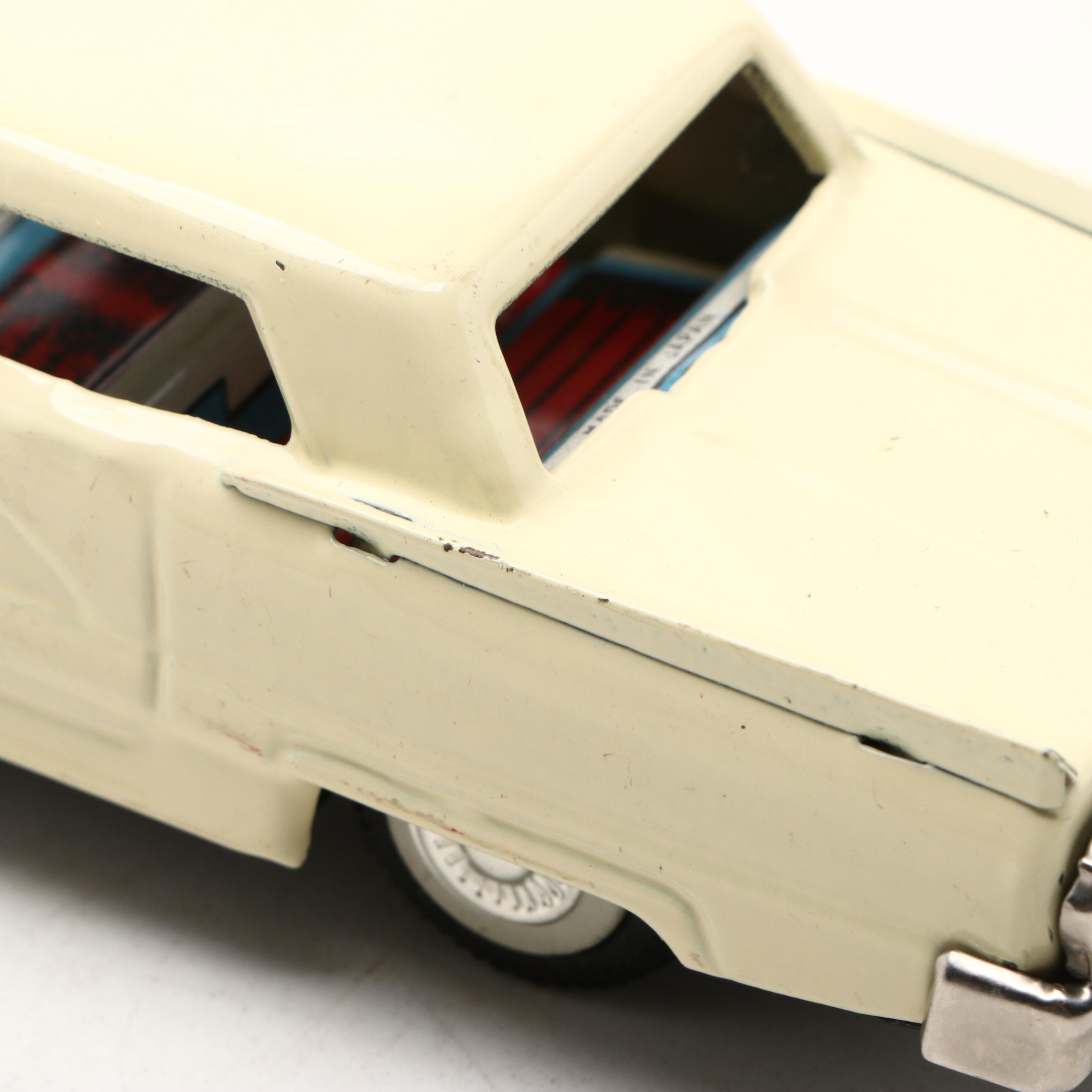 Studebaker Tin Wind-Up Car with More Vintage Toy Cars and Boat