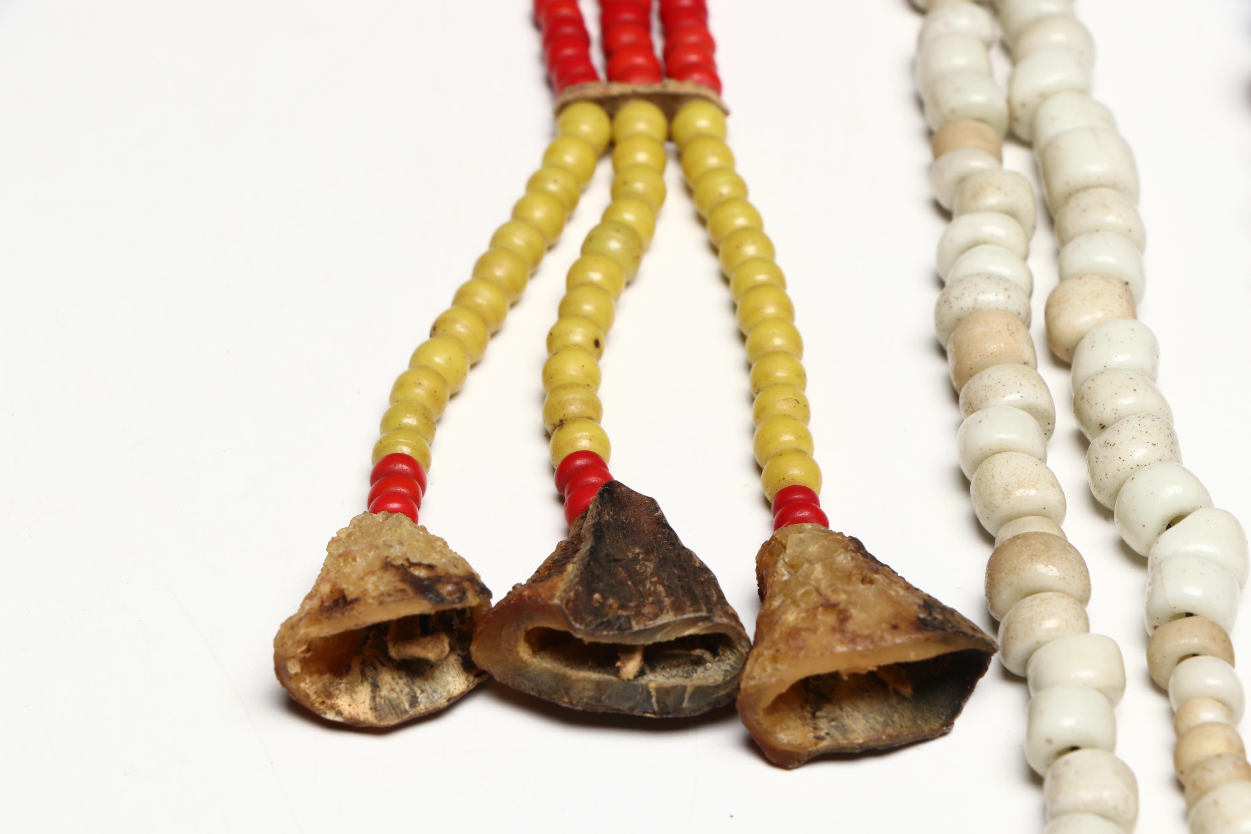 Five Glass Trade Bead Adornments, Two with Deer Dewclaw Suspensions