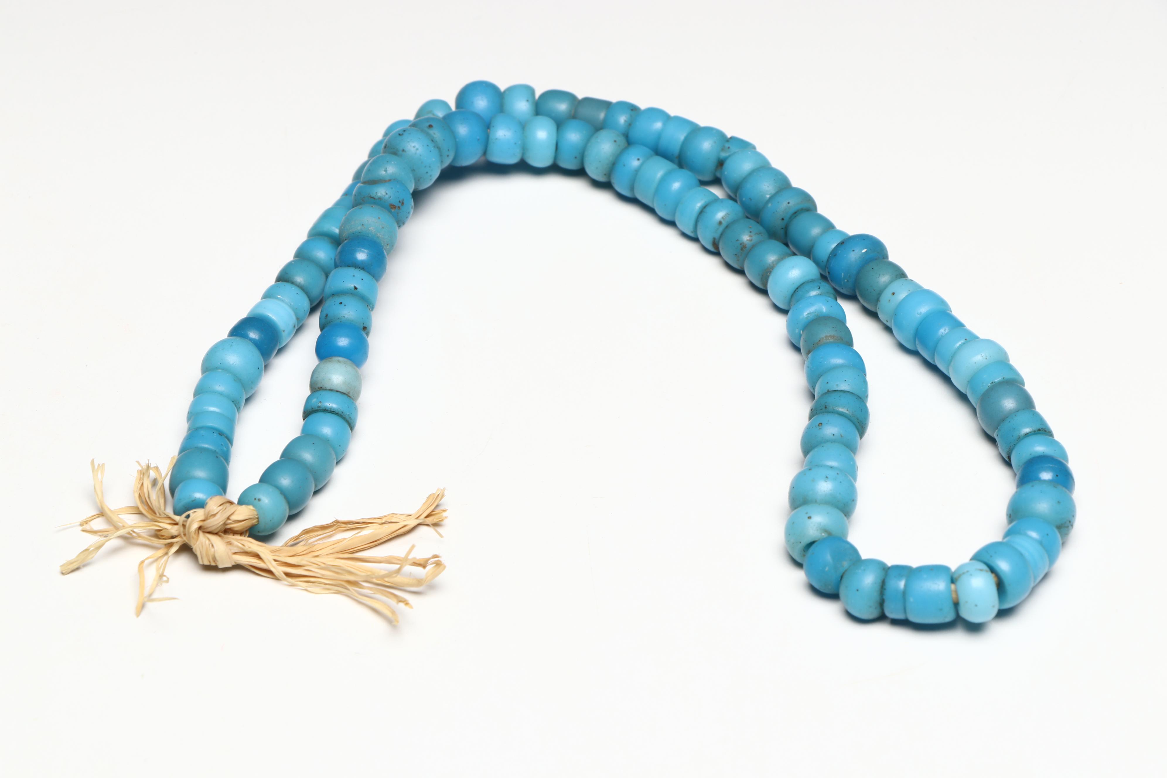 Five Glass Trade Bead Adornments, Two with Deer Dewclaw Suspensions