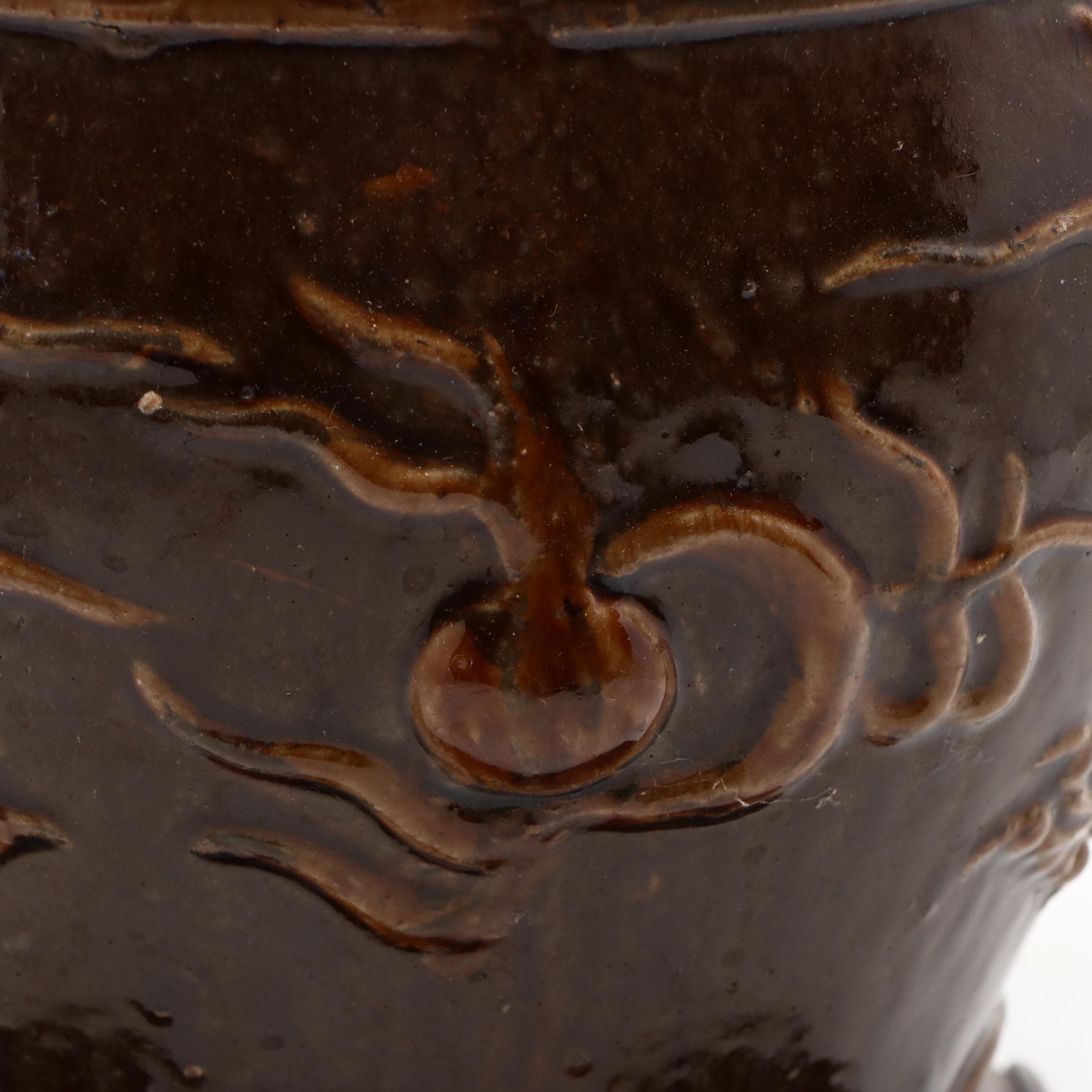 Chinese Brown Glazed Earthenware Dragon Jardinière with Carved Hardwood Stand