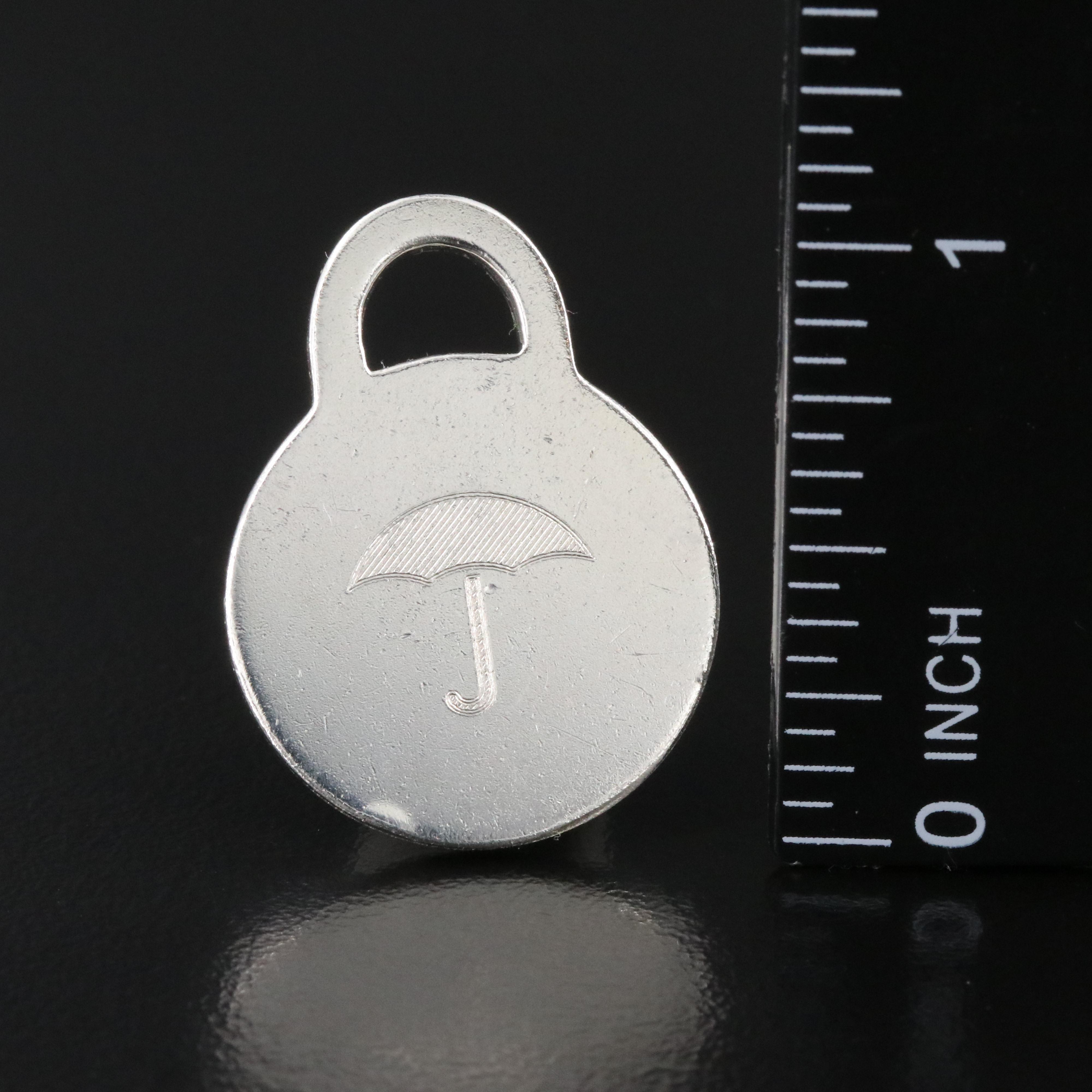 Tiffany & Co. Sterling Round Tag Charm with Travelers Insurance Logo