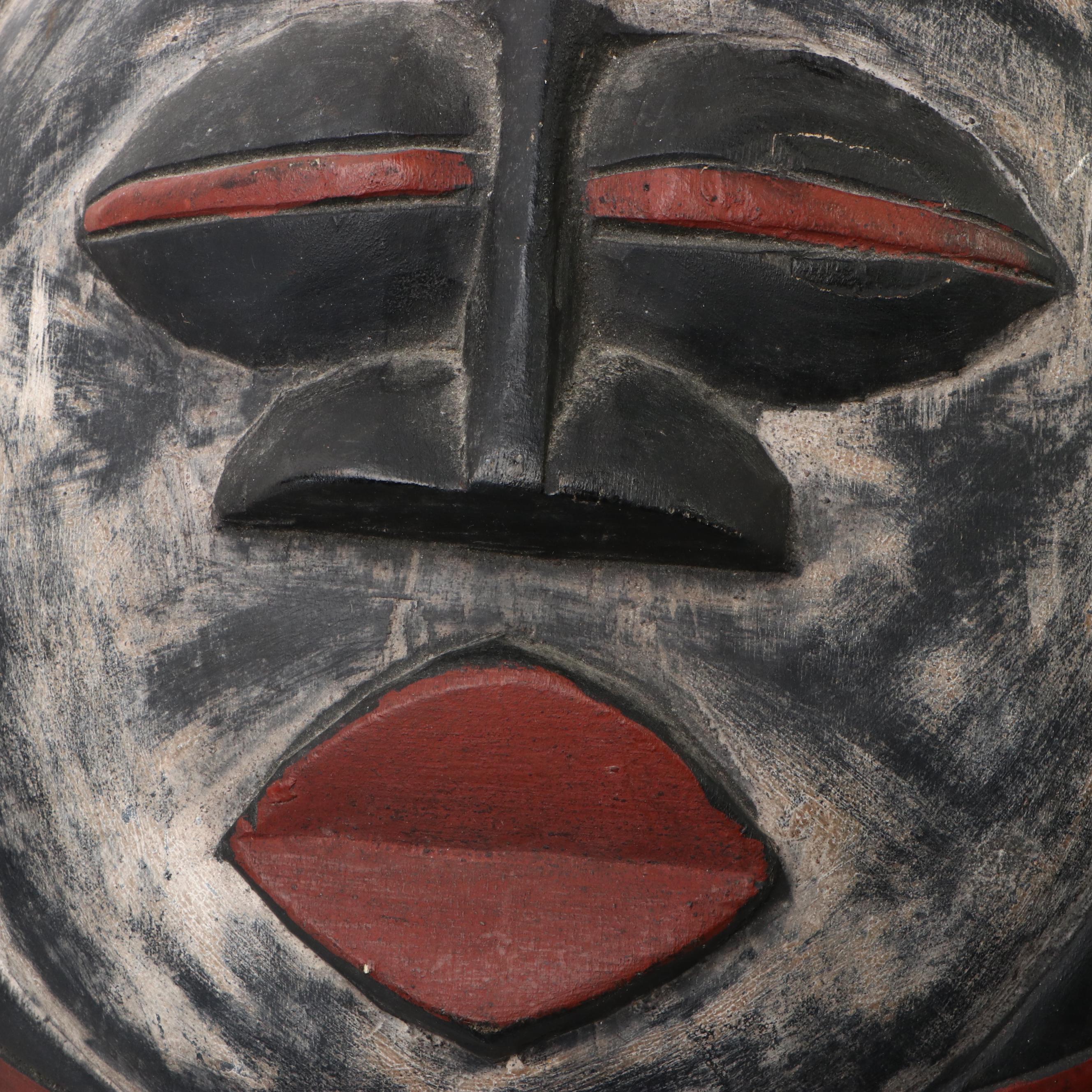 Polychrome Round and Long Carved Wooden Wall Masks