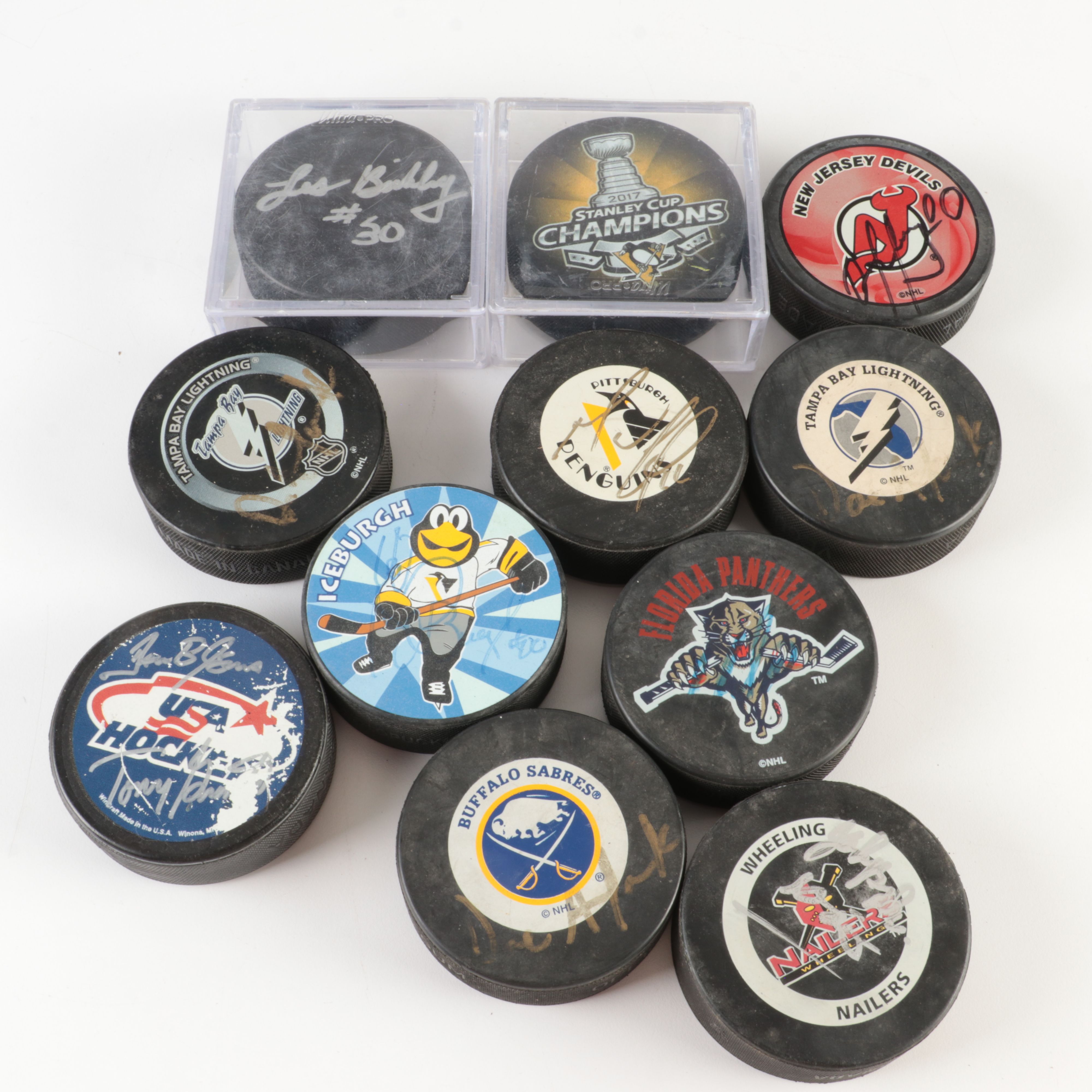 Collection off Signed Footballs, Hockey Pucks, Basketballs, and More