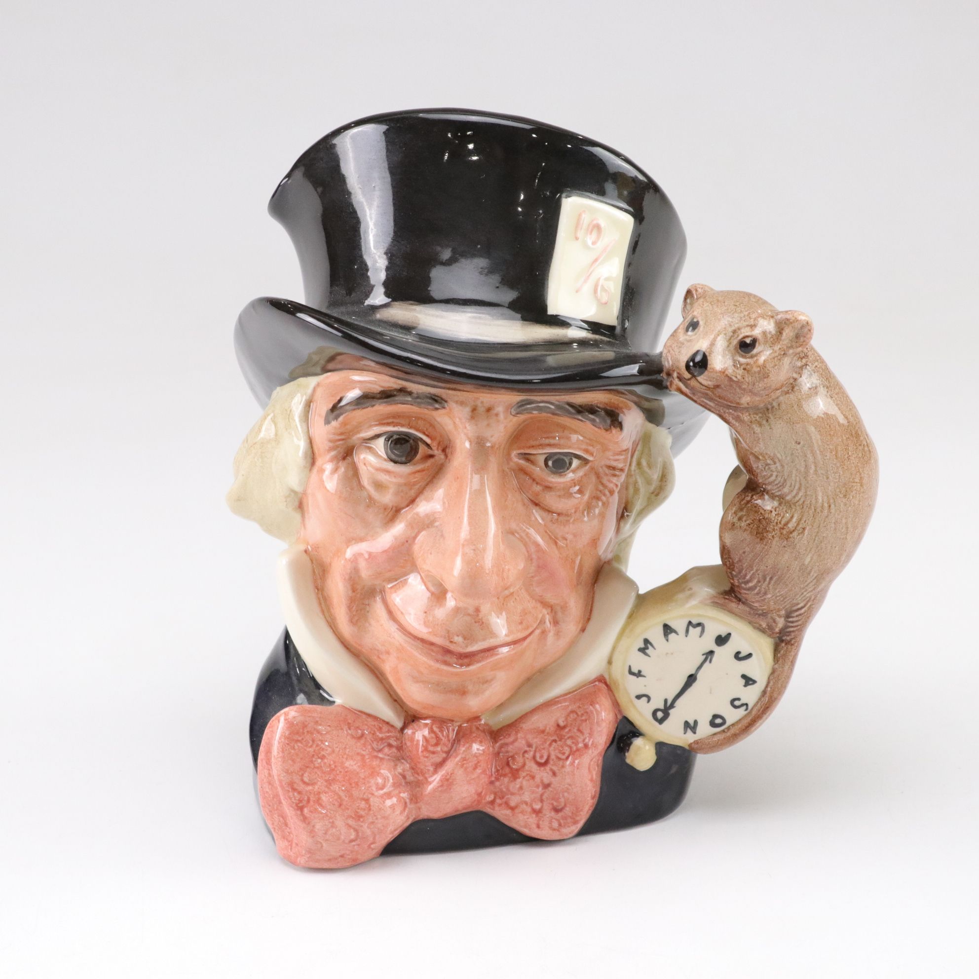 Royal Doulton Toby Jugs "The Mad Hatter", "The Red Queen", and "The Gardener"