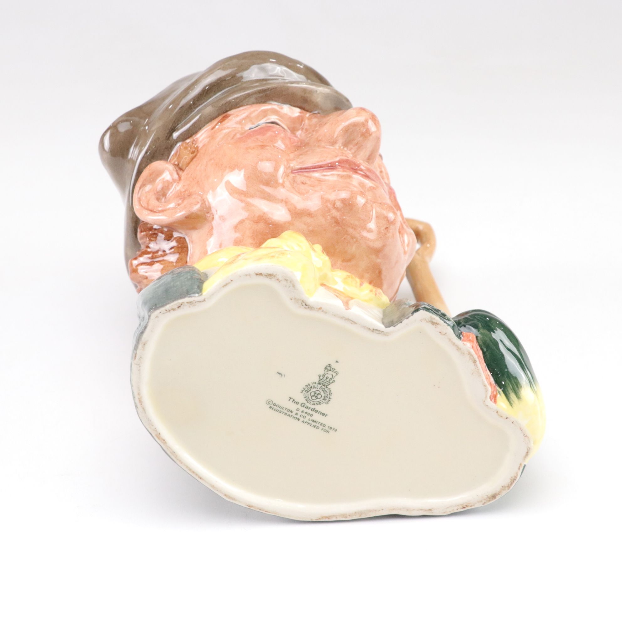 Royal Doulton Toby Jugs "The Mad Hatter", "The Red Queen", and "The Gardener"